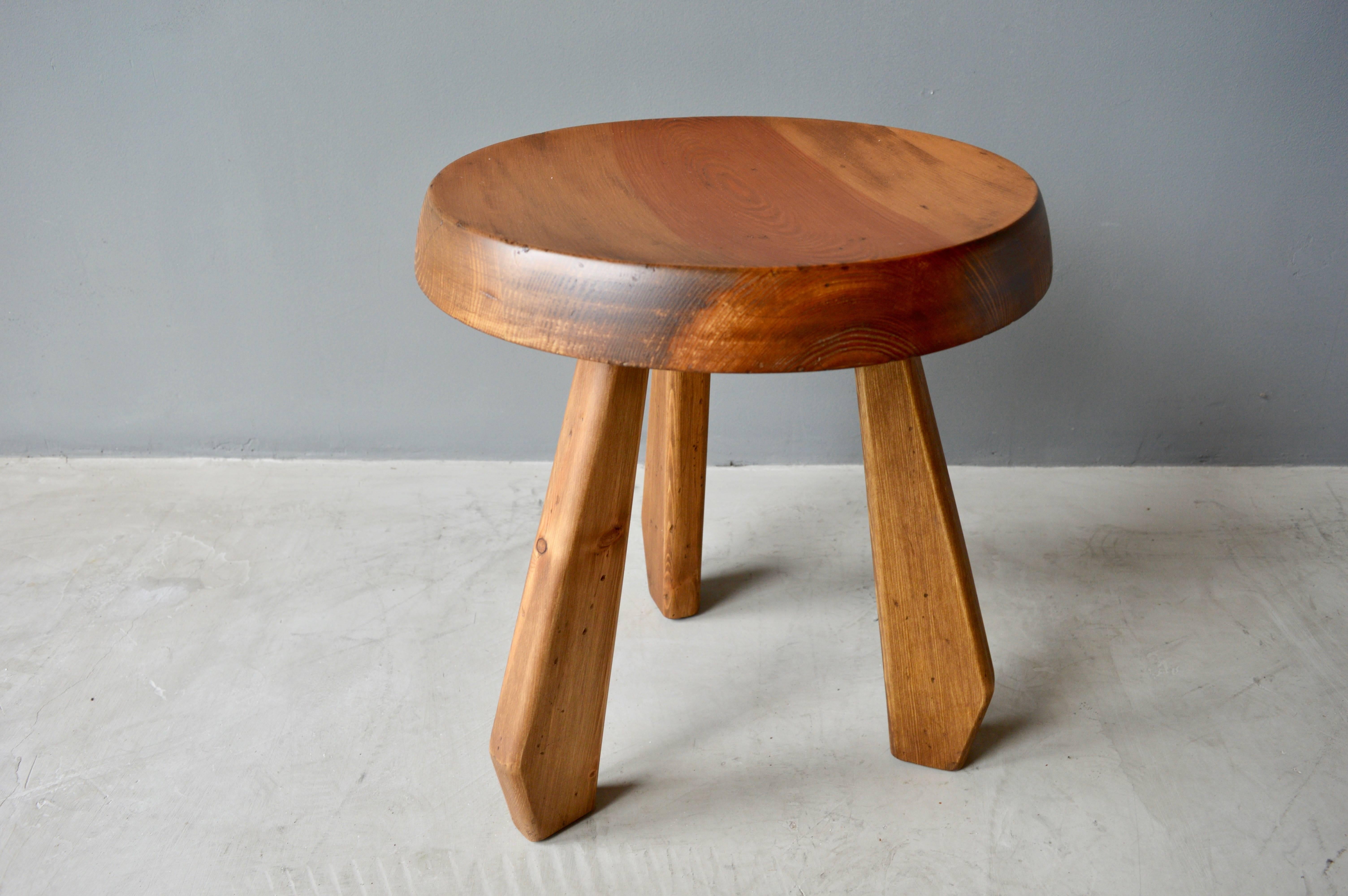Stunning wood stool by Charlotte Perriand. Original condition. Exquisite design.