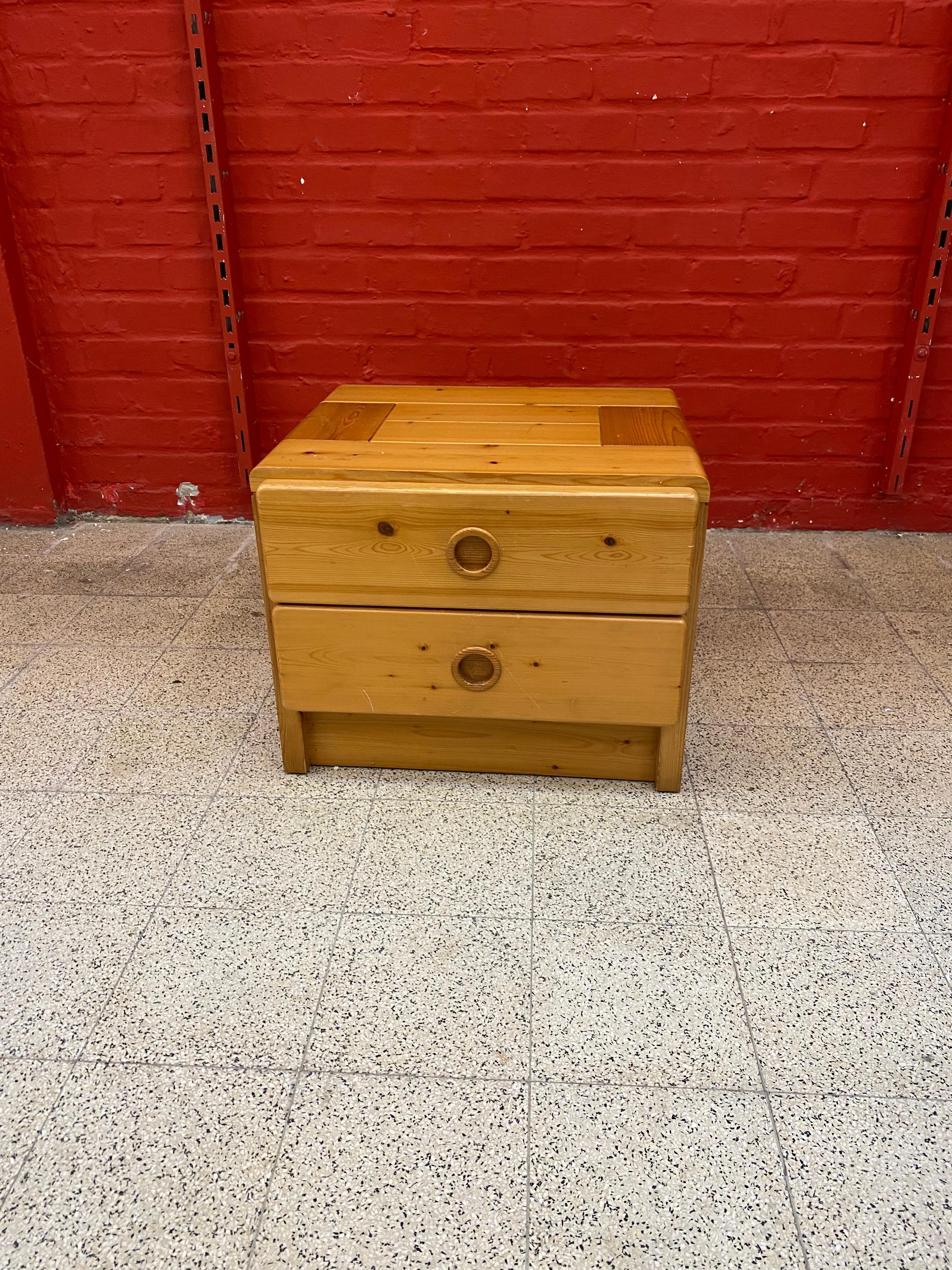 Charlotte Perriand, a bedside table in solid pine, circular handles, LES ARCS, circa 1960.
  