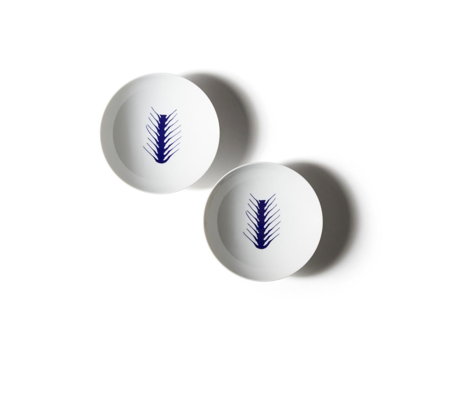 Charlotte Prerriand Set of Two  Deep Arete Plates For Cassina

The exclusivity of a hand-decorated porcelain dinnerware service, based on ancient influences filtered through the modern sensibilities of an extraordinary pioneer of