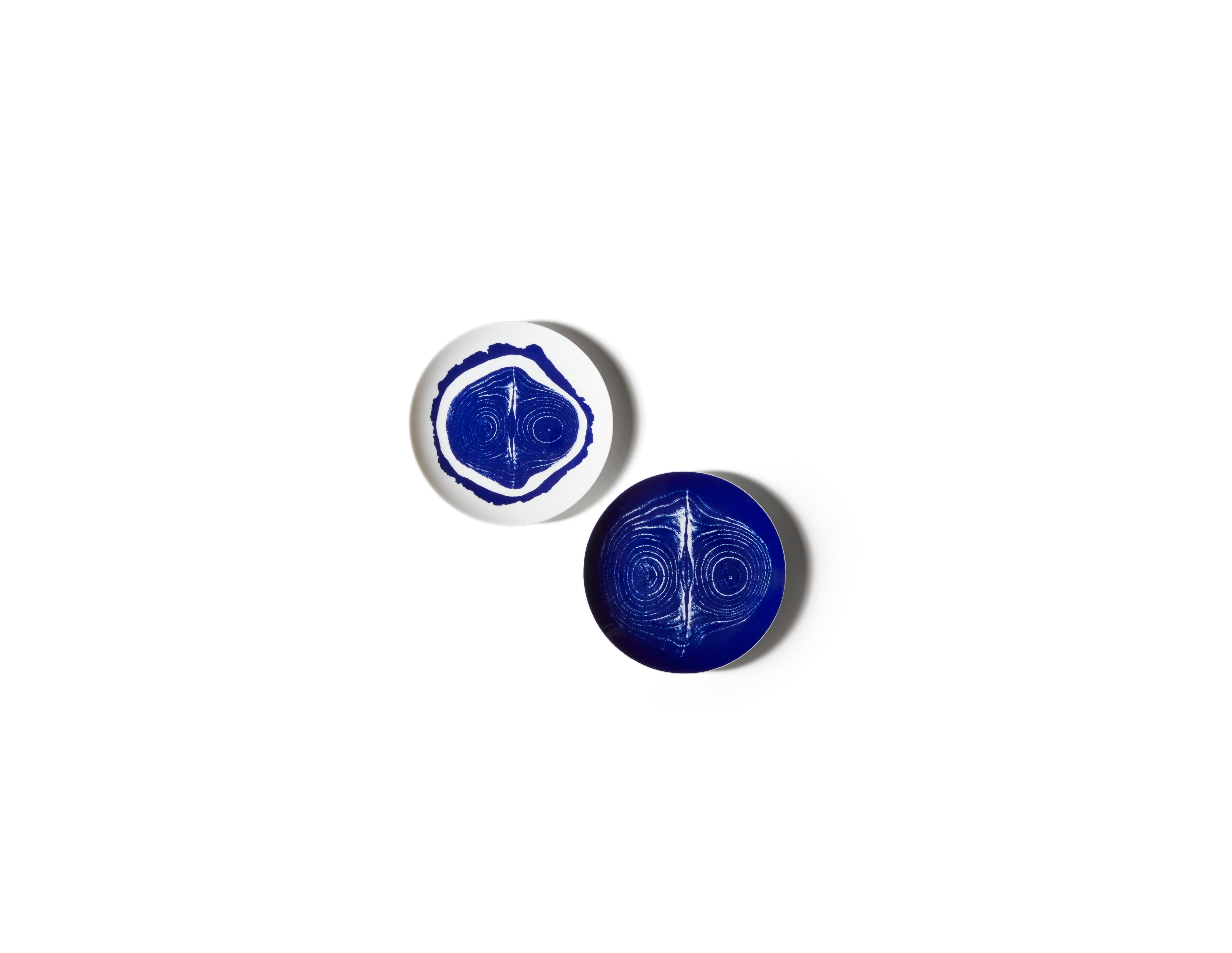 Charlotte Prerriand Set of Two Flat  Tronc Plates For Cassina

The exclusivity of a hand-decorated porcelain dinnerware service, based on ancient influences filtered through the modern sensibilities of an extraordinary pioneer of