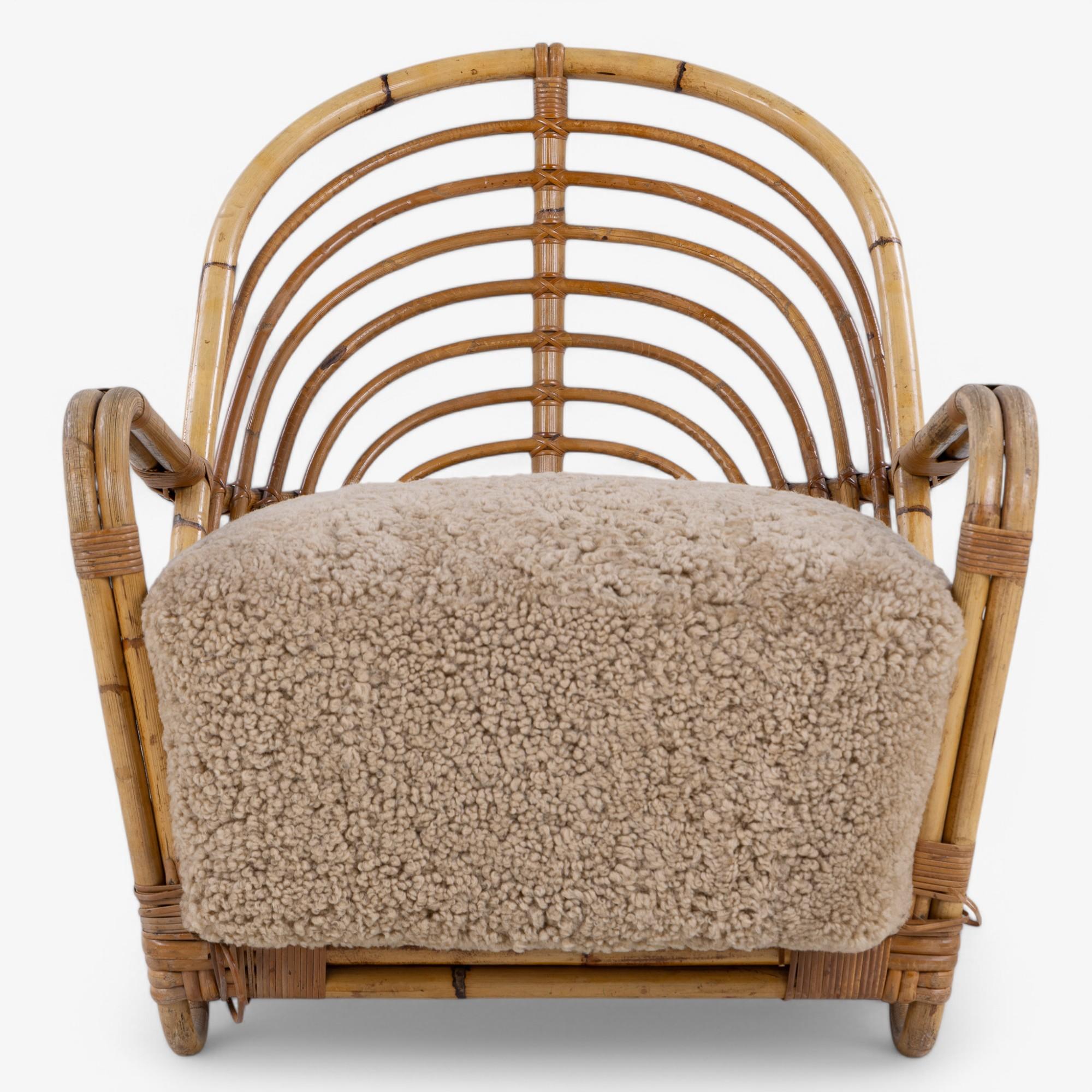 Rare 'Charlottenborg' armchair in bent bamboo with seat in new lambskin (colour: Honey). Designed in 1936 by Arne Jacobsen.