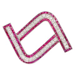 Charlton Art Deco Calibré Ruby, Diamond and Platinum Brooch of Geometric Motif