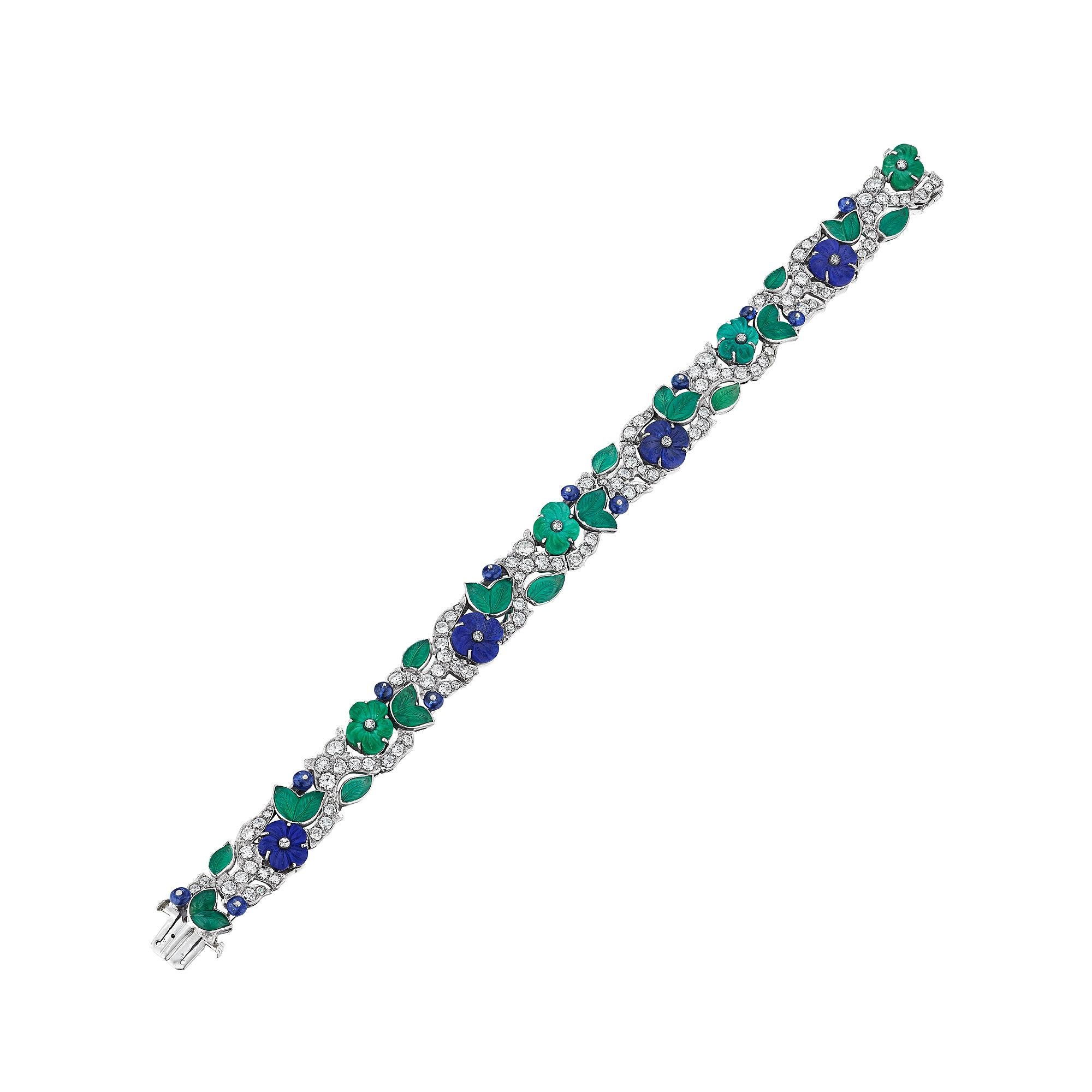 Bursting with joyful flowers, this Art Deco Charlton New York sapphire, diamond, lapis, and chalcedony bracelet is an everlasting garden party.  With carved sapphire beads, electric blue lapis and fresh green chalcedony flowers in full bloom, this
