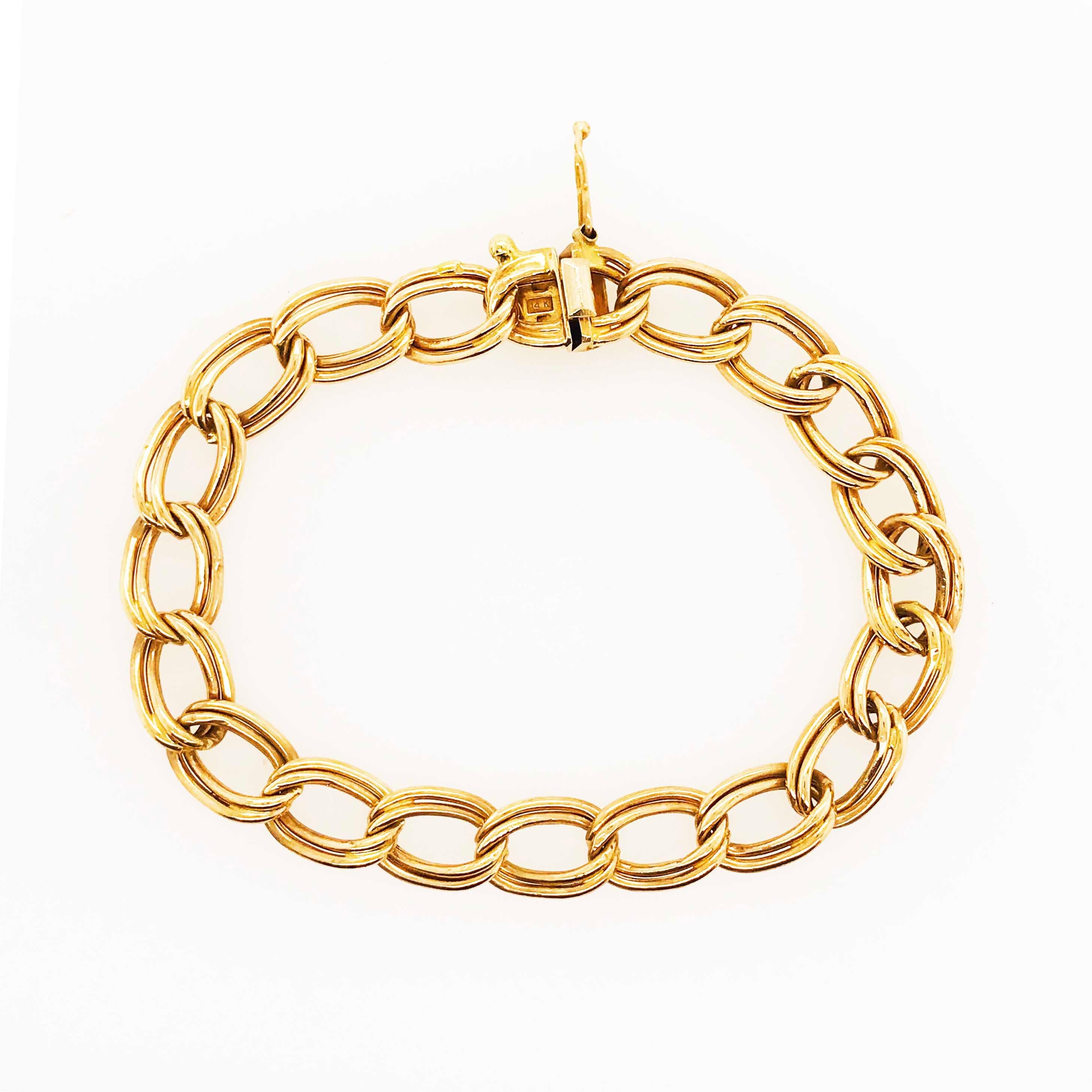 This retro 1979 charm bracelet is made of solid 14 karat yellow gold.  It is perfect for putting charms on or to wear it by itself or accompanying other bracelets.  The bracelet is 7 inches long and approximately 1/2 wide and also has a really cool,