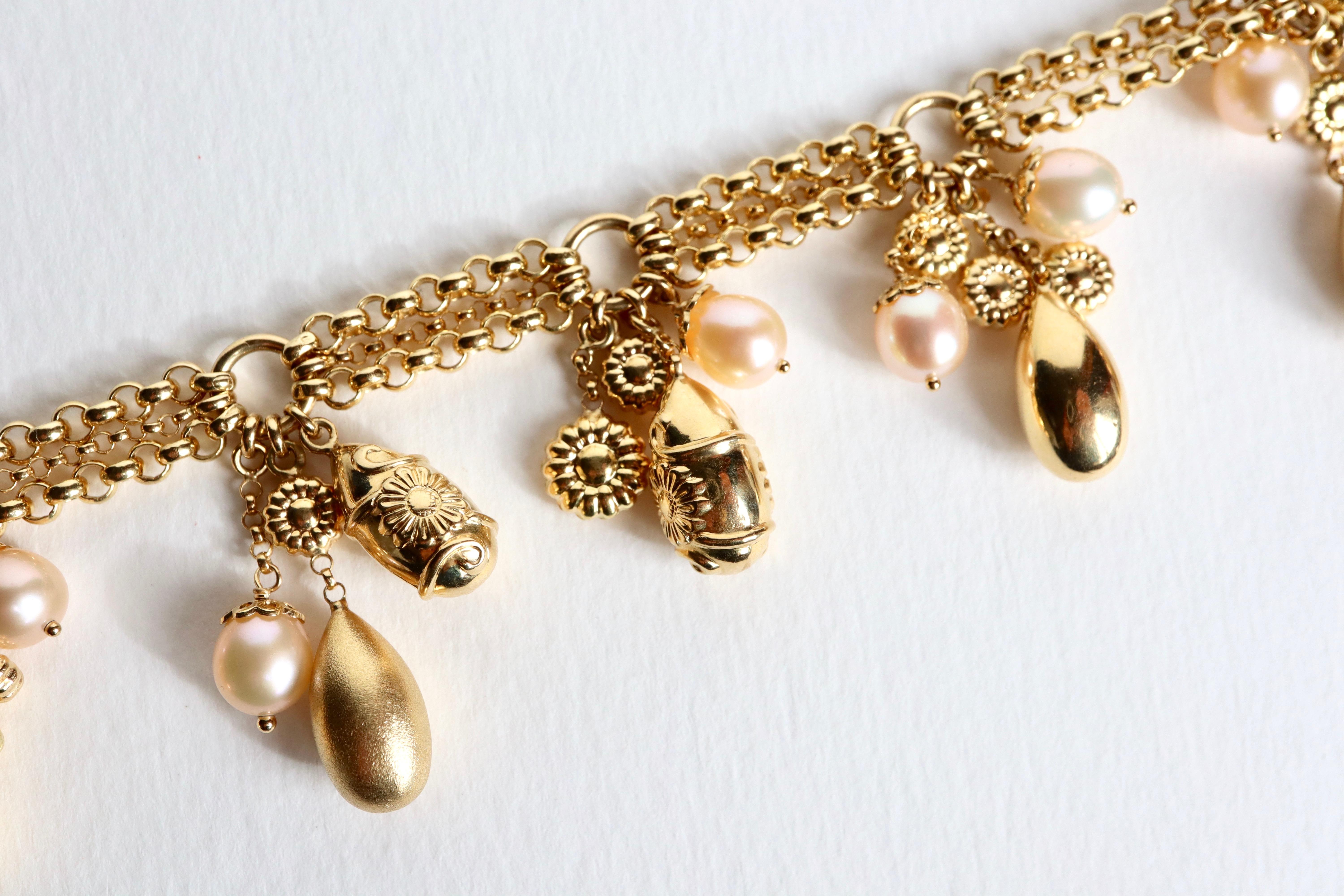 Charm bracelet in 18 carat yellow gold 3 alternating chains of chiseled circles holding 6 groups of charms including: pearls, gold eggs and flower motifs. Made in Italy
Stick clasp. Eagle Head Hallmark. 
Length: 19 Cm Height of charms: 3.3 cm Chain