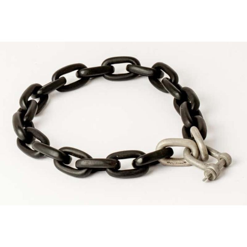 All organic chain is carved by hand. In the case of the chains made of wood, they are absolutely seamless; carved from a single long slab of wood (see link). 
The Charm System is an interrelated group of products that can be mixed and matched or