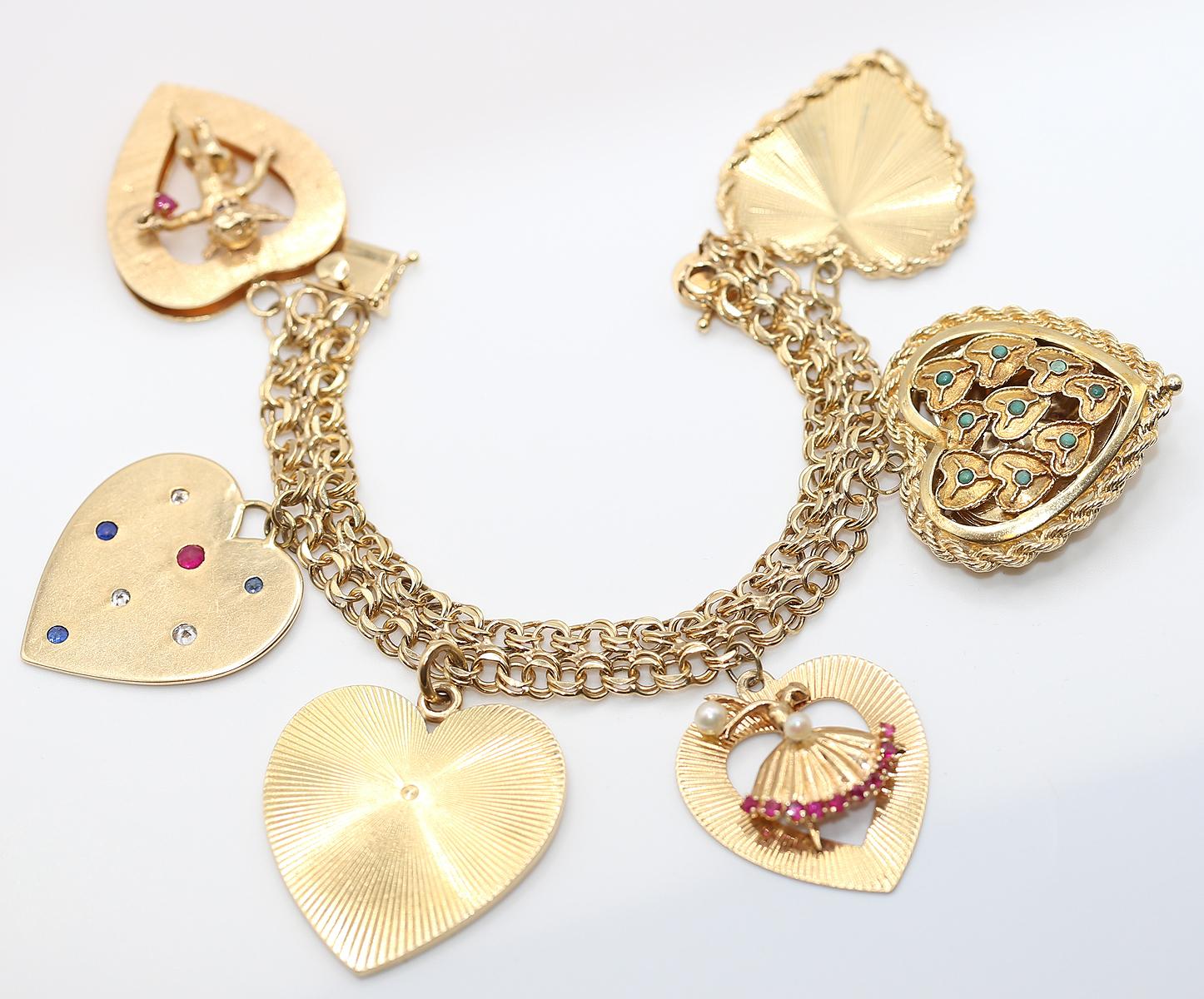 Massive Charm Bracelet 14K Yellow Gold signed Tiffany on the Heart charm and  POM on the bracelet lock. Created in late 1950-es.

Originally purchased on the Sotheby’s auction. New York auction Important Jewels 2 Feb 2011. Please take a look at the