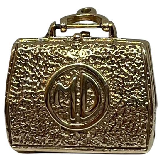 14 kt gold doctor's case charm.