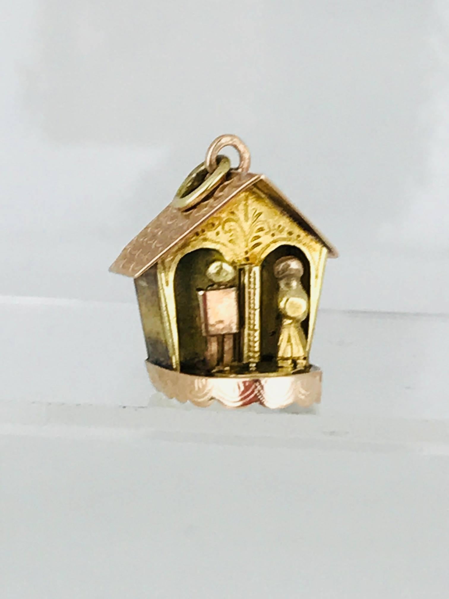 House with movable people, spin in a circle through the house. 14 karat yellow and pink gold this charm is handmade. Circa 1950
Rare, one of a kind collectable.

GIA Gemologist, Inspected & Evaluated.