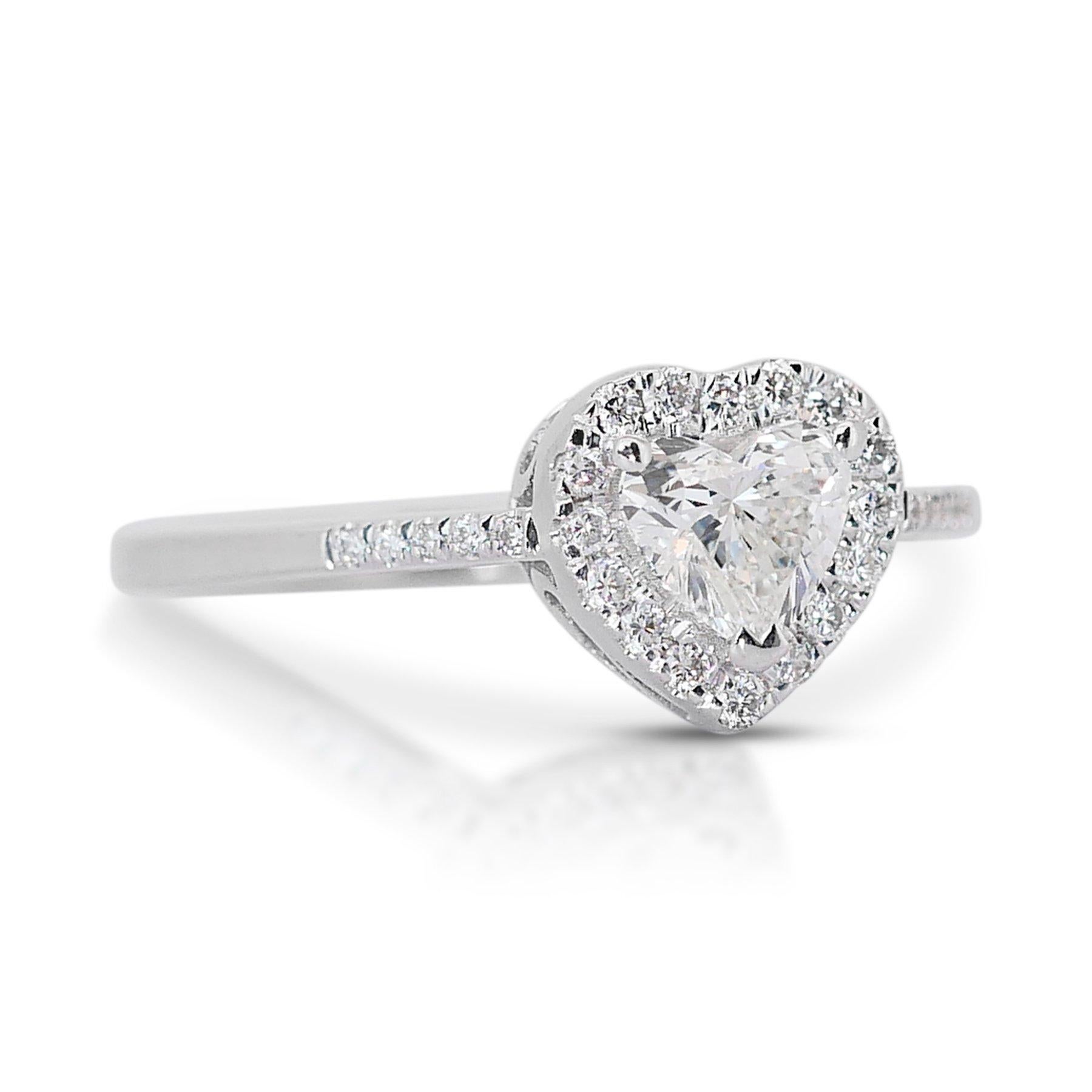 Charming 0.75ct Diamonds Halo Ring in 18k White Gold - IGI Certified

This enchanting halo ring features a main heart-shaped diamond weighing 0.55 carats. Surrounding the central diamond are 26 round diamonds that collectively weigh 0.20 carats.