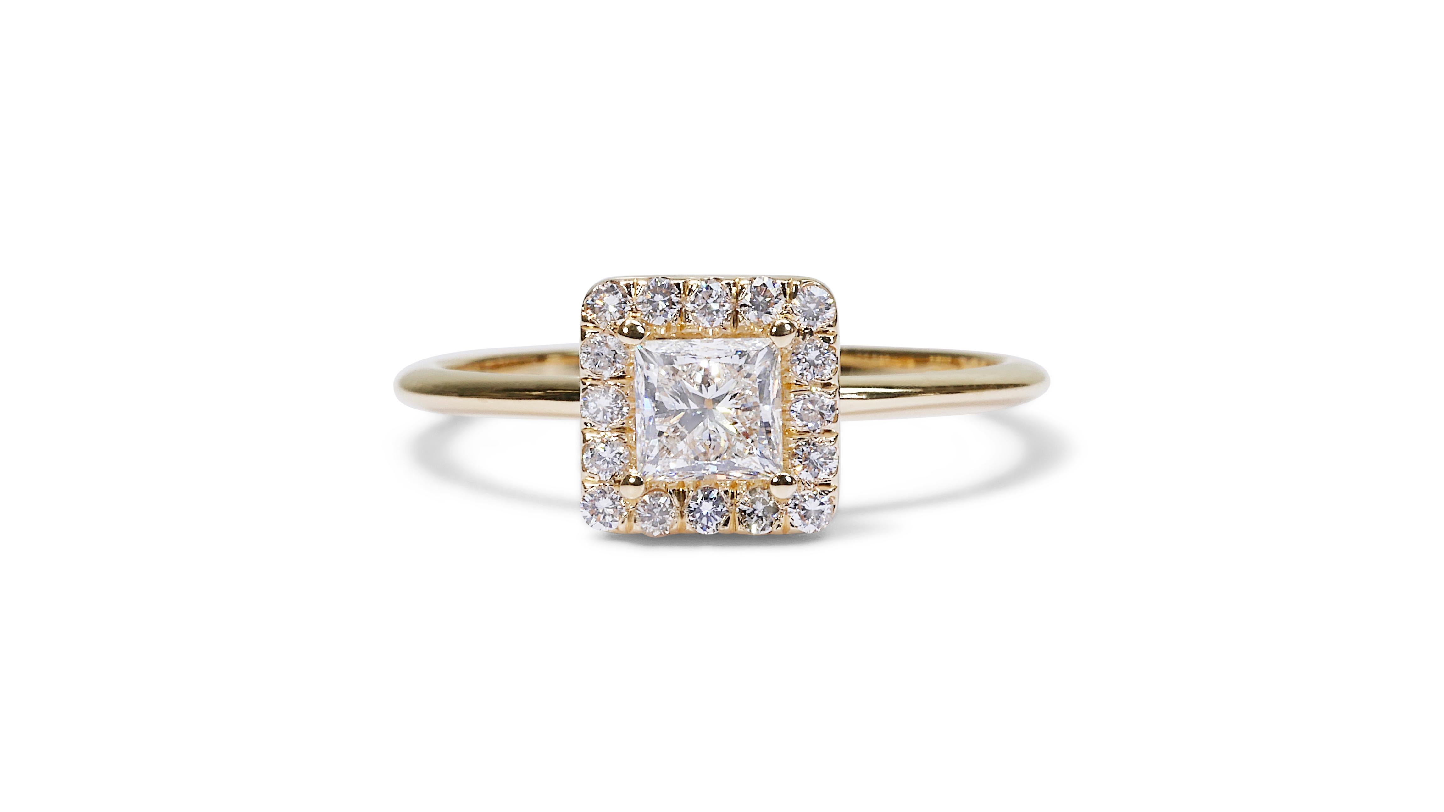 Charming 0.90ct Square-Cut Diamond Halo Ring in 18k Yellow Gold - GIA Certified

This elegantly designed diamond halo ring, crafted from rich 18k yellow gold, features a captivating 0.73-carat square-cut diamond at its centerpiece. Complemented by