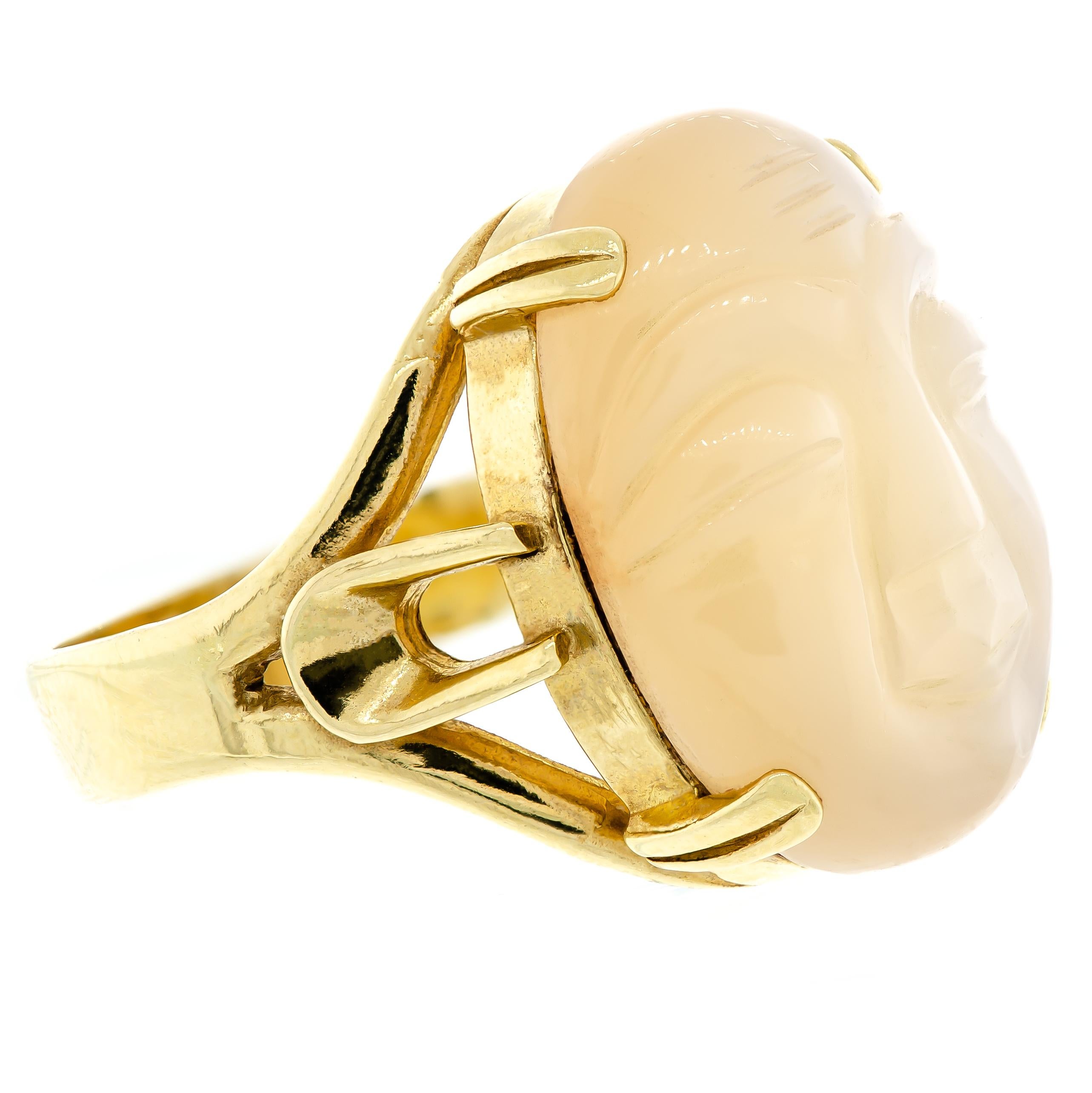 Charming vintage 14 karat yellow gold 'man in the moon' carved Moonstone ring. The oval-shaped stone is finely carved with a delightful smiling man-in-the-moon face. An exquisite ring featuring a handsome design makes this piece is an absolute gem.