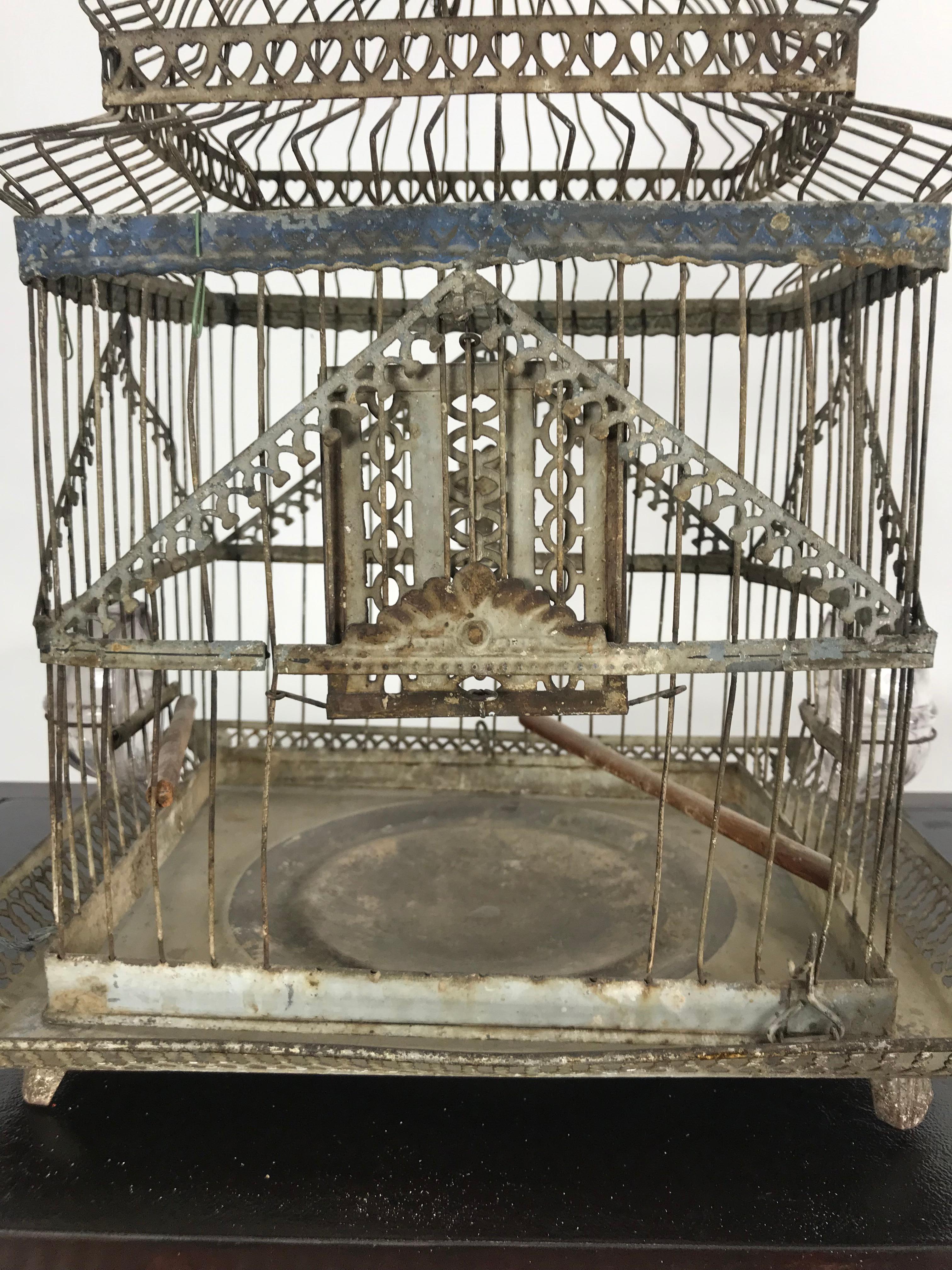 Charming 19th century architectural birdcage, hand painted decorated bottom.