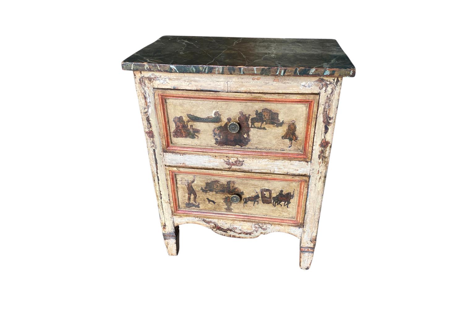 A very charming early 19th century Arte Povera Comodini from Northern Italy. Beautifully constructed in the Louis XVI style with a lovely faux marble painted top and 2 drawers. A wonderful accent piece to lend warmth and charm to its surrounding.