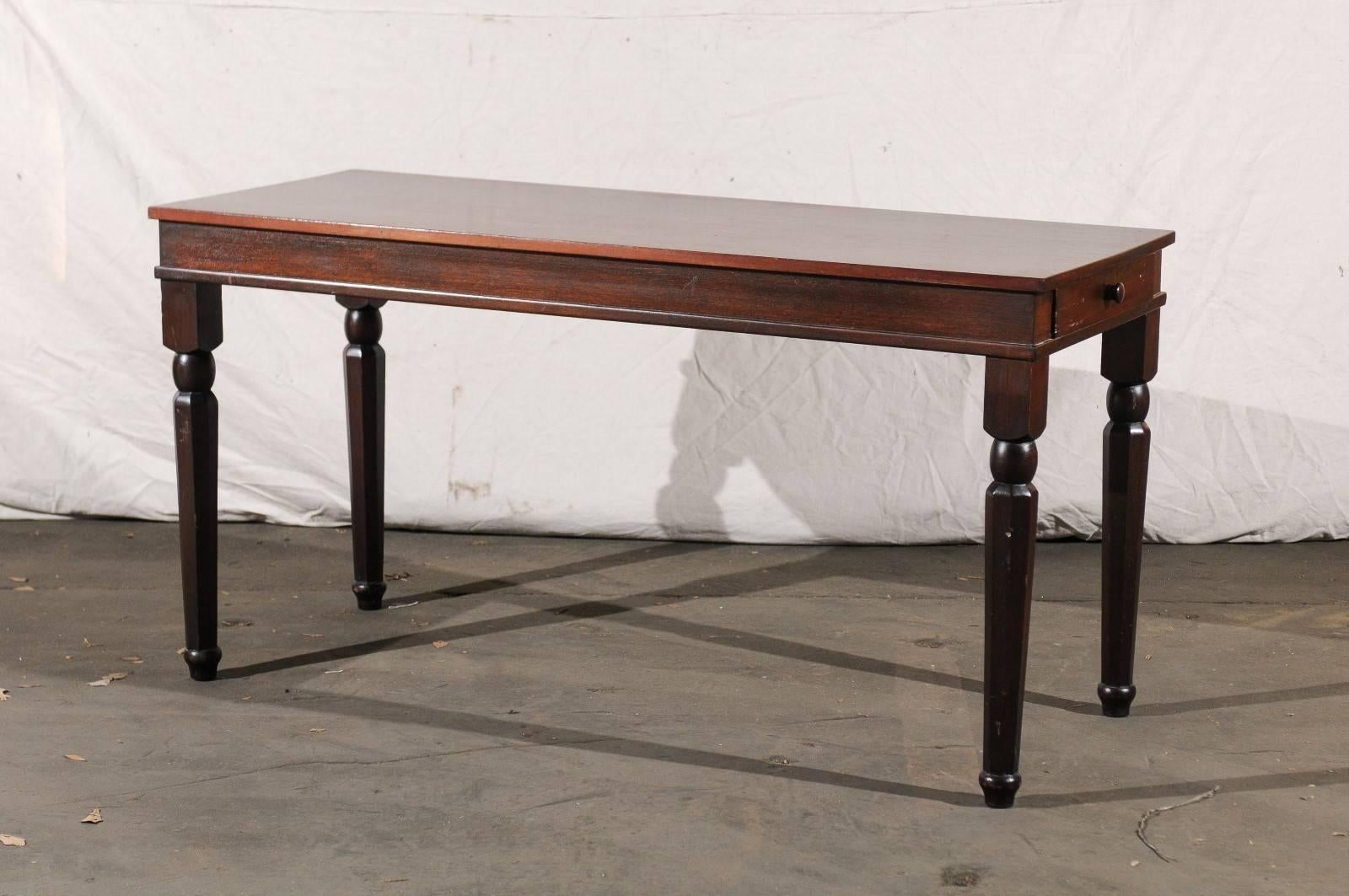 Charming 19th century long English mahogany table with single drawer.