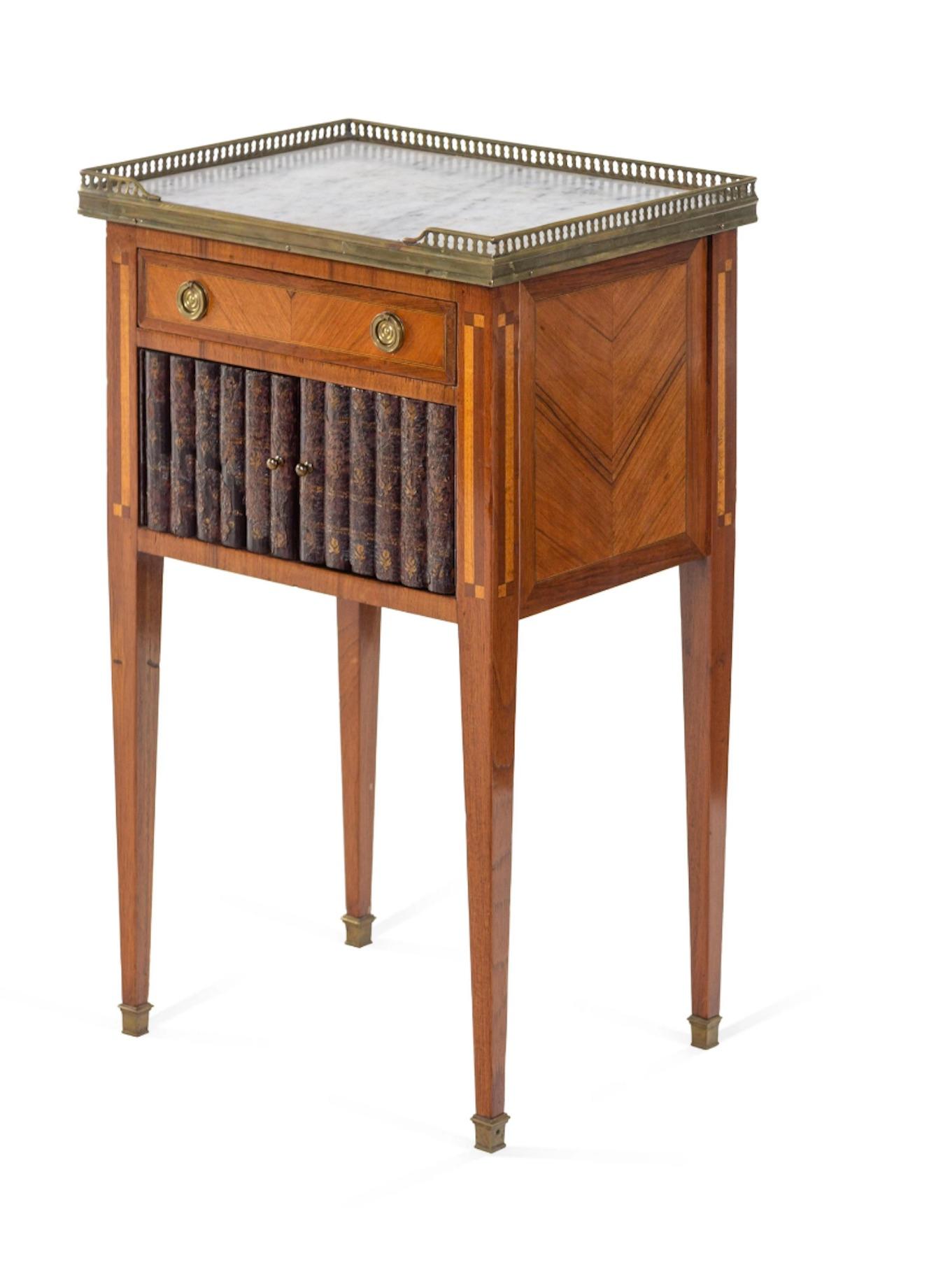 Charming 19th century side table, faux book doors, marble top, brass gallery. Measure: 28