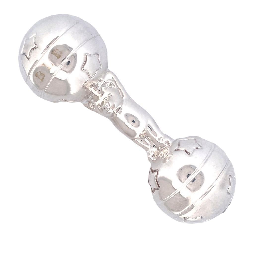 Delight your little one with our adorable 925 Sterling Silver Tiffany & Co Bear Ball Baby Rattle. Crafted with care, this rattle showcases a charming bear and balls. Made from high-quality sterling silver, the balls has engraved designs of stars and