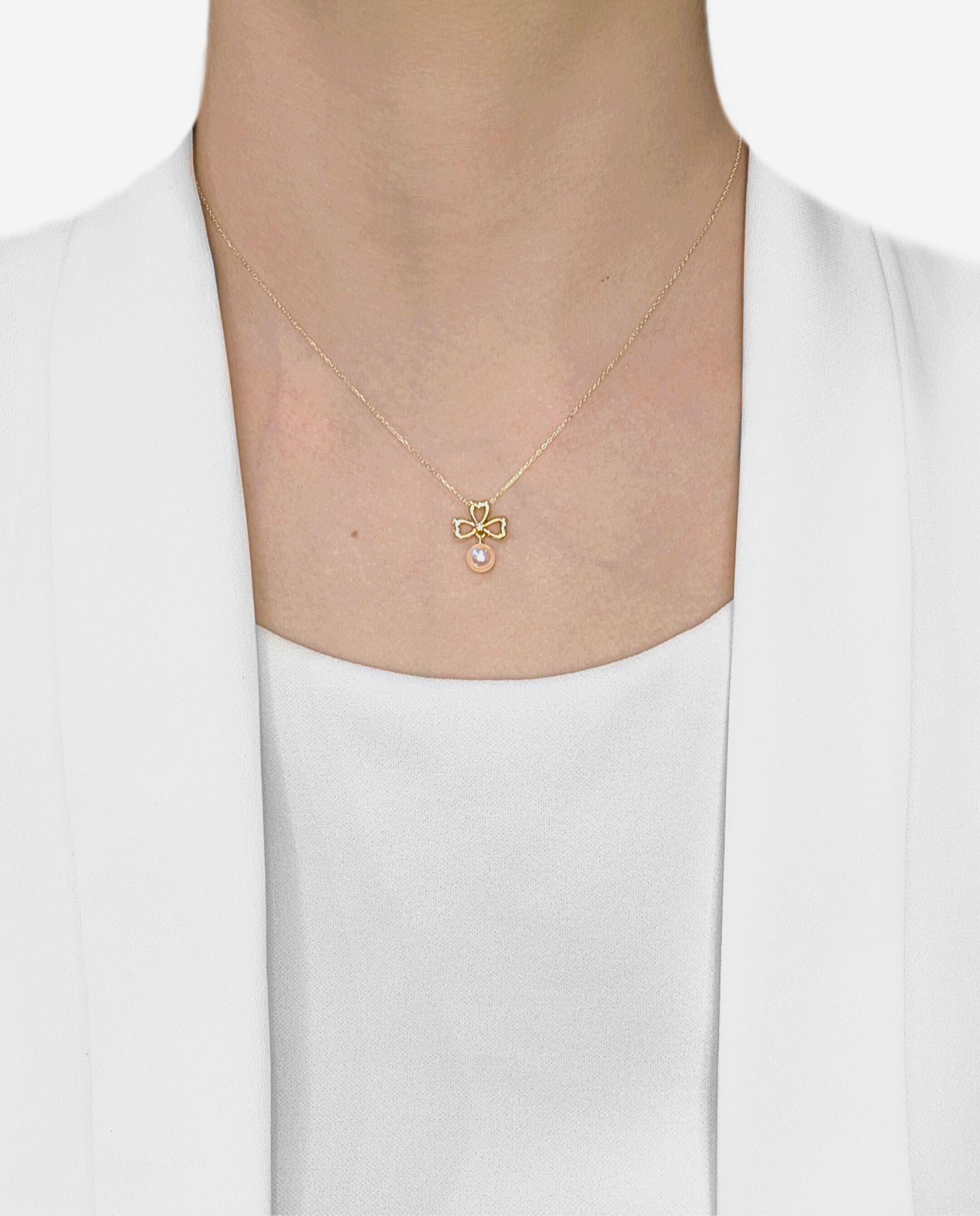 This charming necklace is crafted in luxurious 18K yellow gold, featuring a delicate clover-shaped design with heart motifs. At its center sparkles a natural round brilliant diamond weighing 0.003ct (I-J color, SI clarity), adding just the right