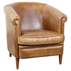 Fauteuil club charmant et confortable en cuir de vache de couleur cognac clair