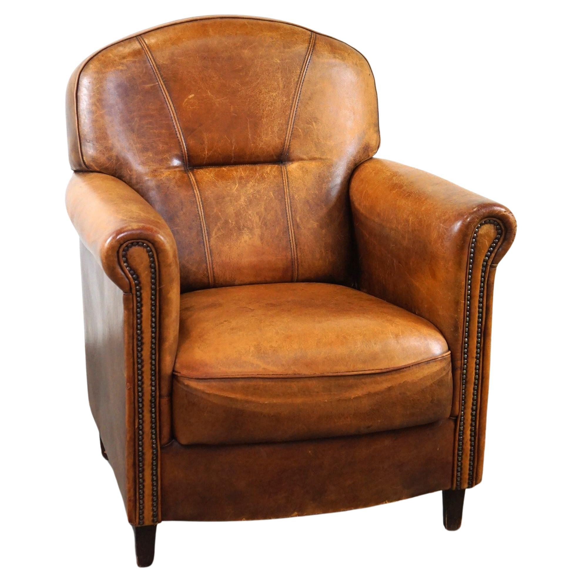 Charming and rugged sheepskin leather armchair, large model