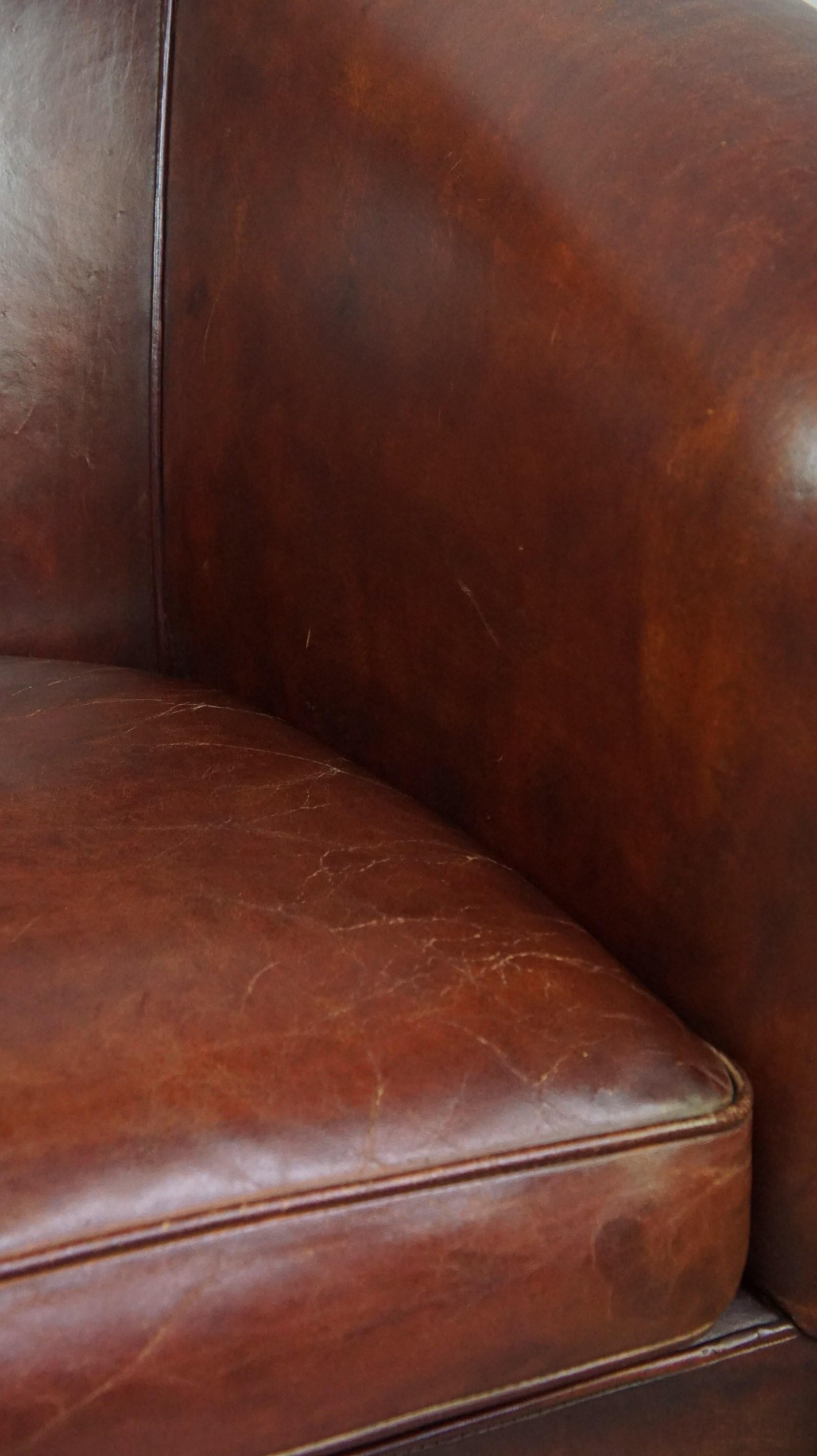 Charming and spacious sheepskin leather club armchair For Sale 6