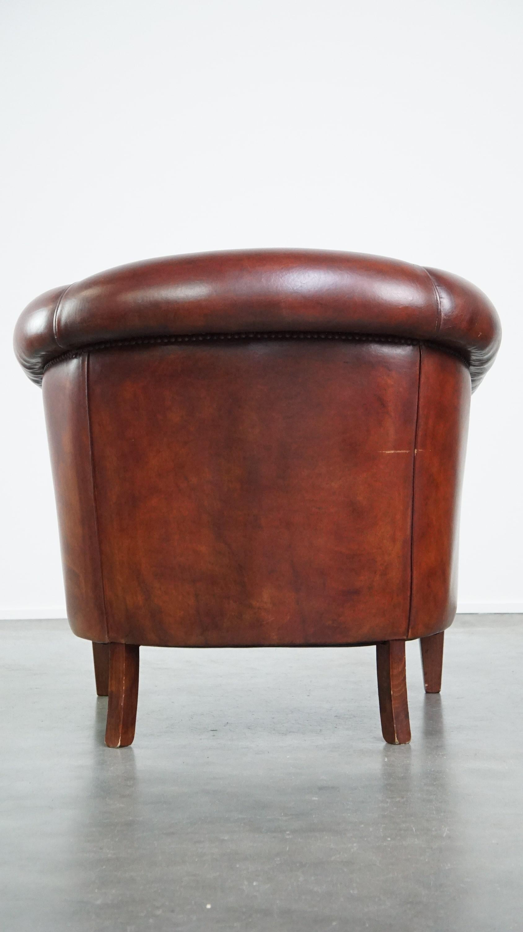 Hand-Crafted Charming and spacious sheepskin leather club armchair For Sale