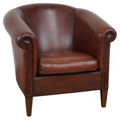 Charming and spacious sheepskin leather club armchair
