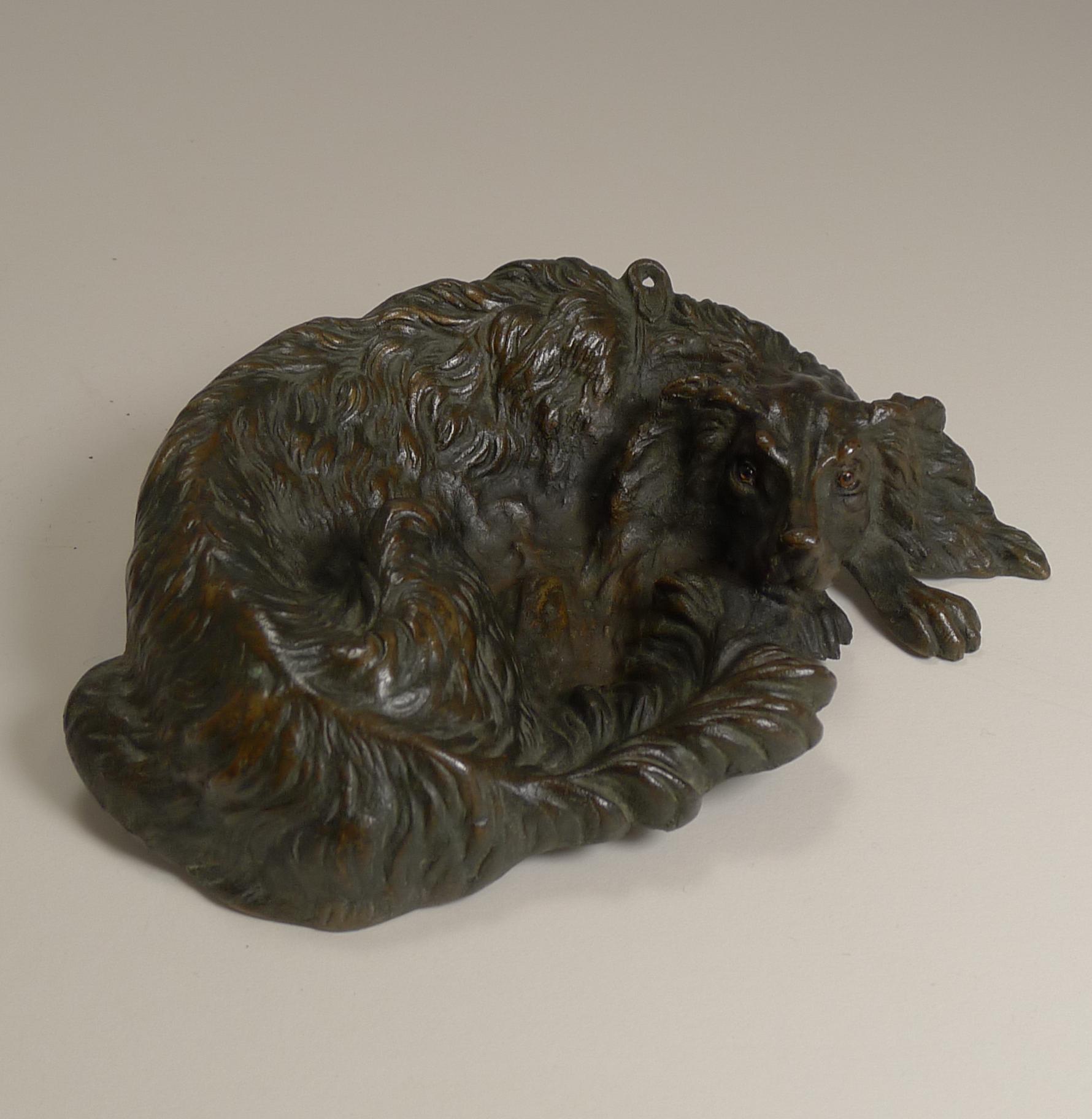 Beautiful and charming, this canine Vide Poche (empty pocket) dish.

Of course what makes this so special is the lovely dog form cast from bronze, probably Austrian, could be English, the dog looks very much like a Spaniel, and retains the two