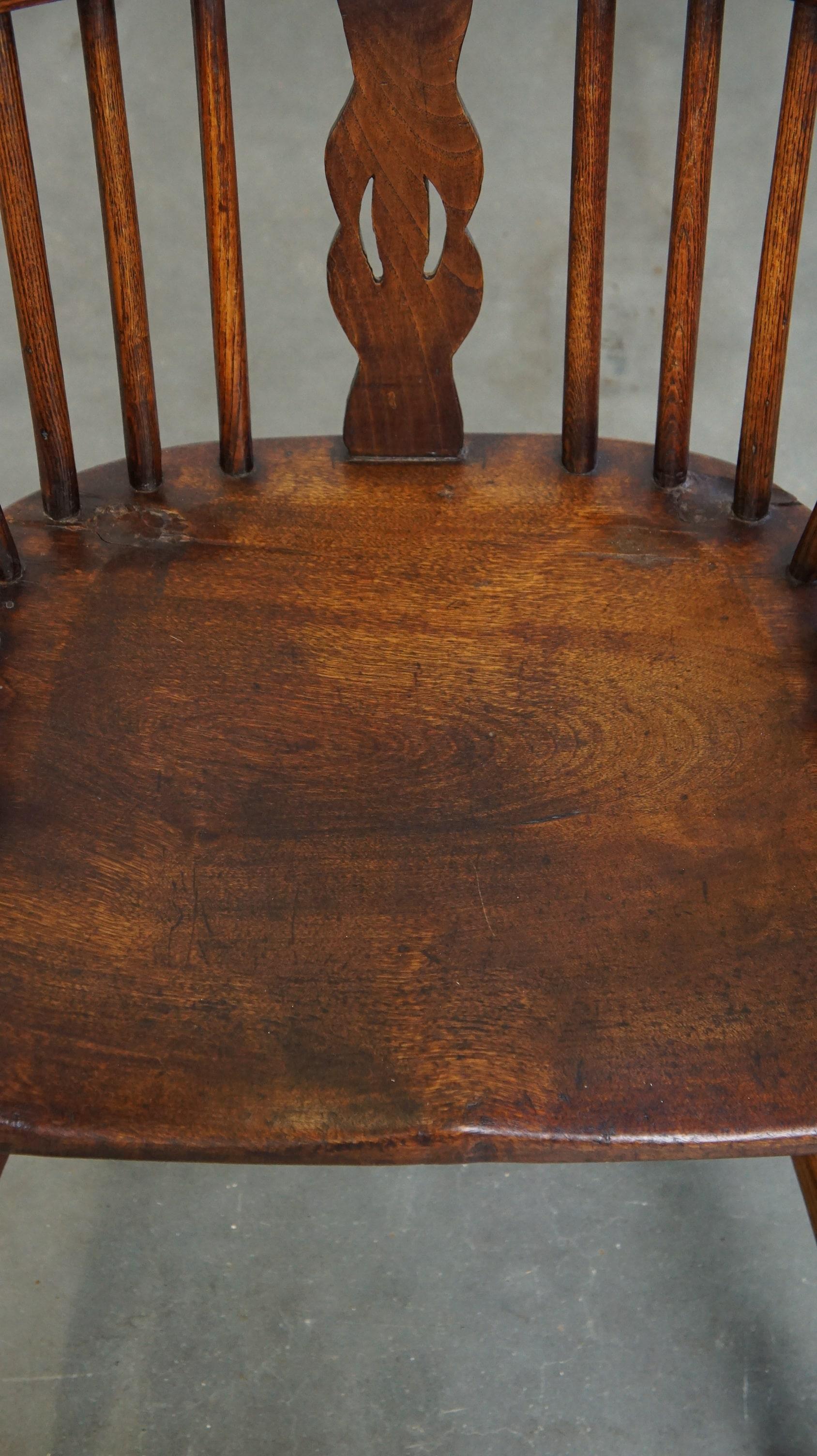 Wood Charming, antique English highback Windsor dining chair with beautiful patina For Sale