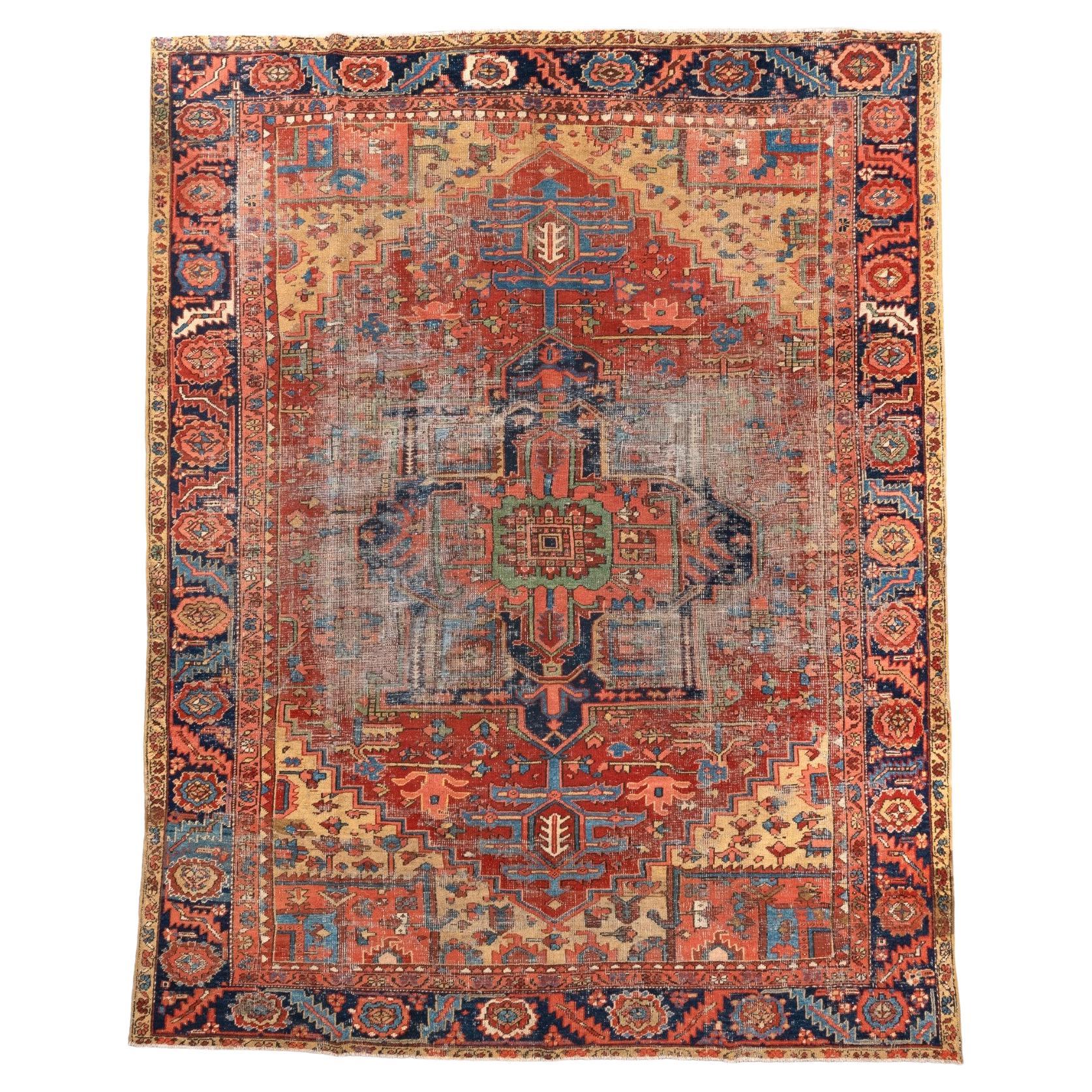 Charming Antique Heriz with Rust Field and Navy Medallion