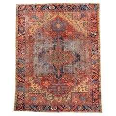 Charming Antique Heriz with Rust Field and Navy Medallion