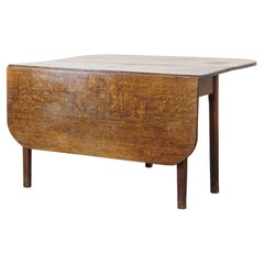 Charming antique oak hanging ear dining table from the late 19th century