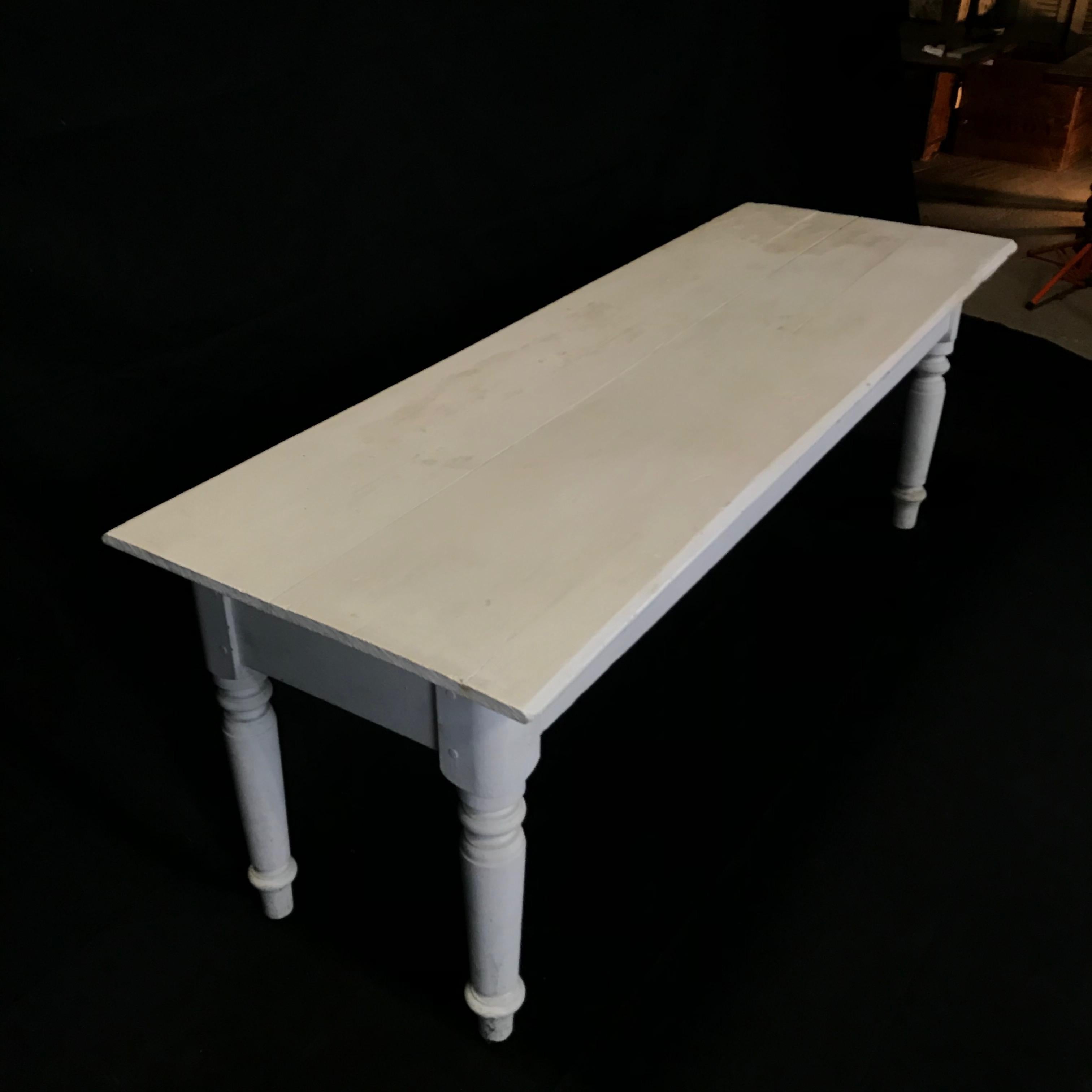Early country farmhouse table with original mortise and tenon construction reinforced with handcut wooden dowels and vintage ivory paint. Great size and versatility.
#4287

Measures: H skirt 22.25”.