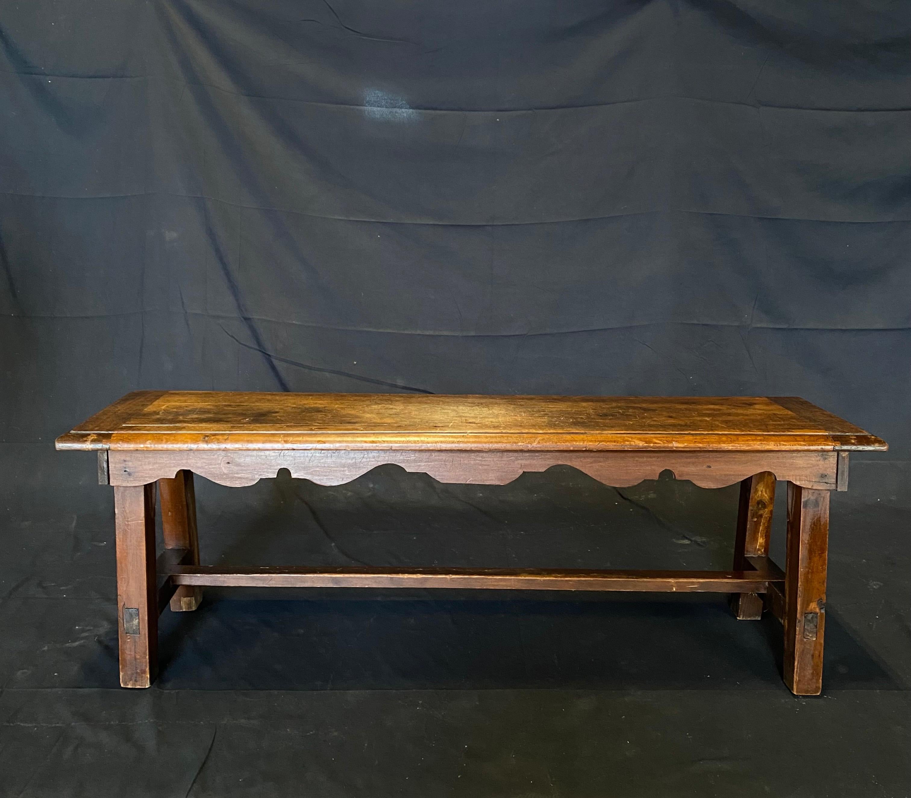 Lovely and sturdy walnut bench with decorative hand carved apron. 

#5637.