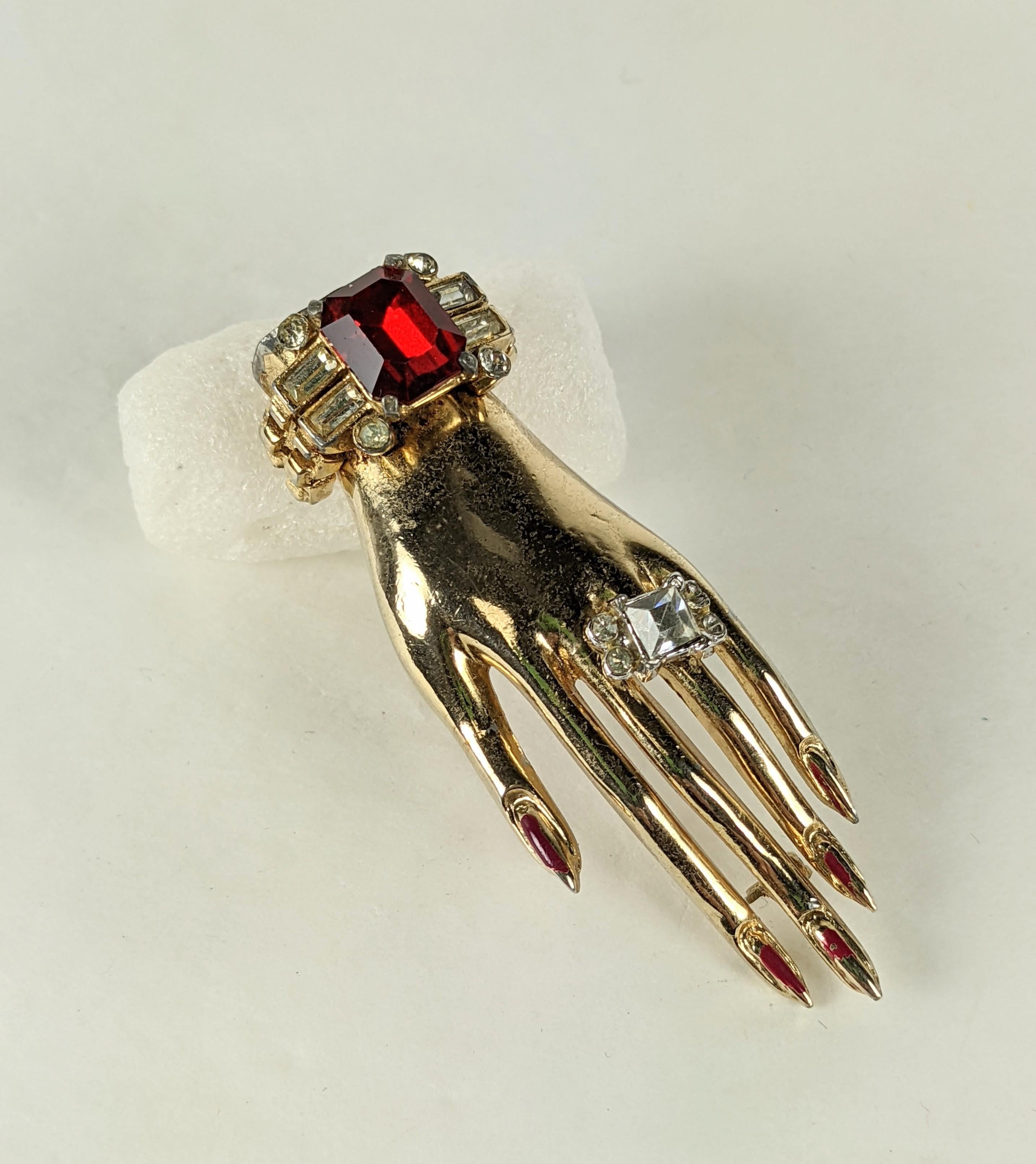 Charming Coro Art Deco Jeweled hand brooch from the 1930's. A gilt metal hand with large paste 