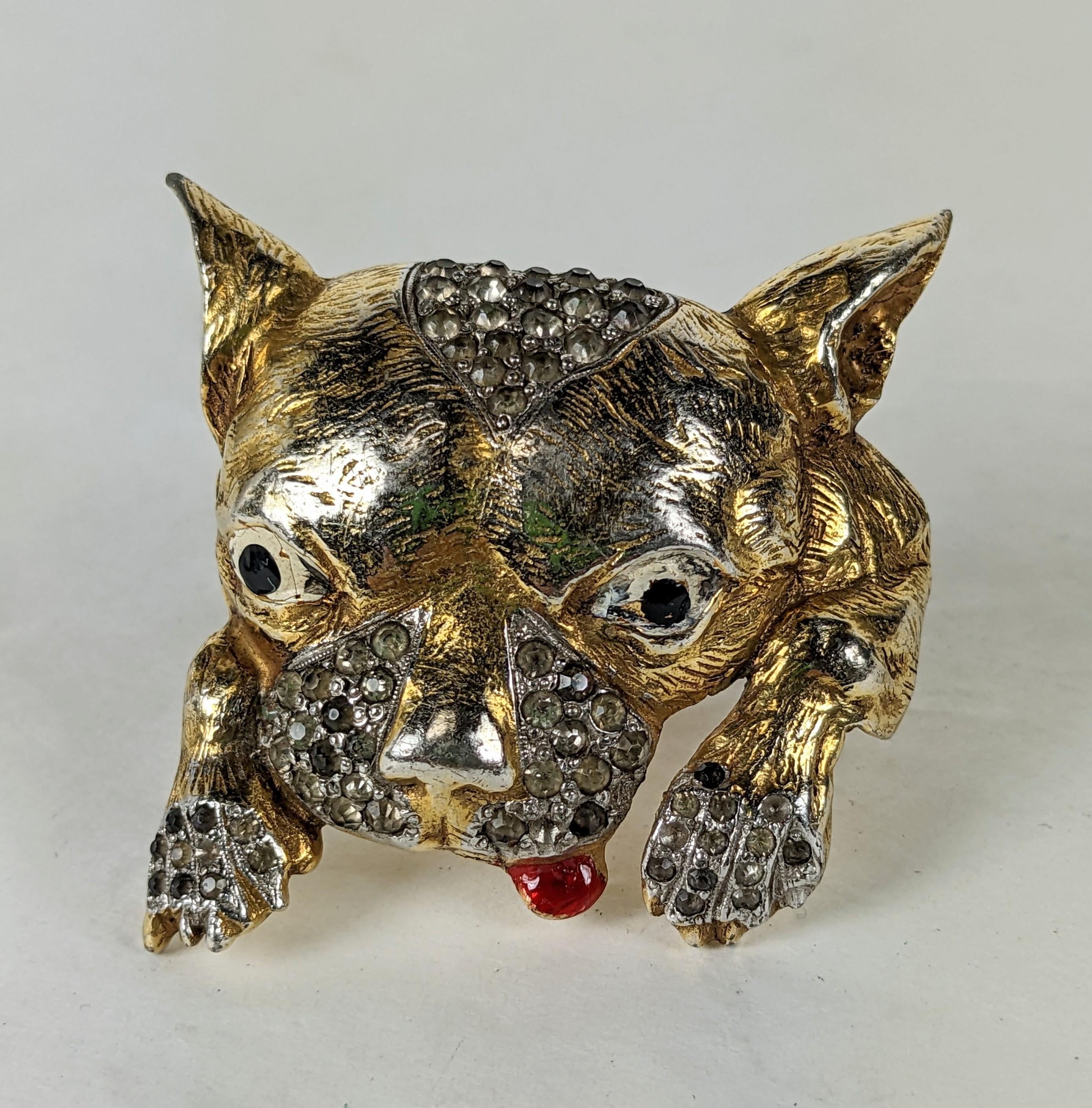 Charming Art Deco Puppy Brooch from the 1930's.  A cartoon styled excited pup with enamel and pave crystal accents throughout and a hanging enameled tongue. Works well on a shoulder.
1930's USA. Likely made by Coro. 2