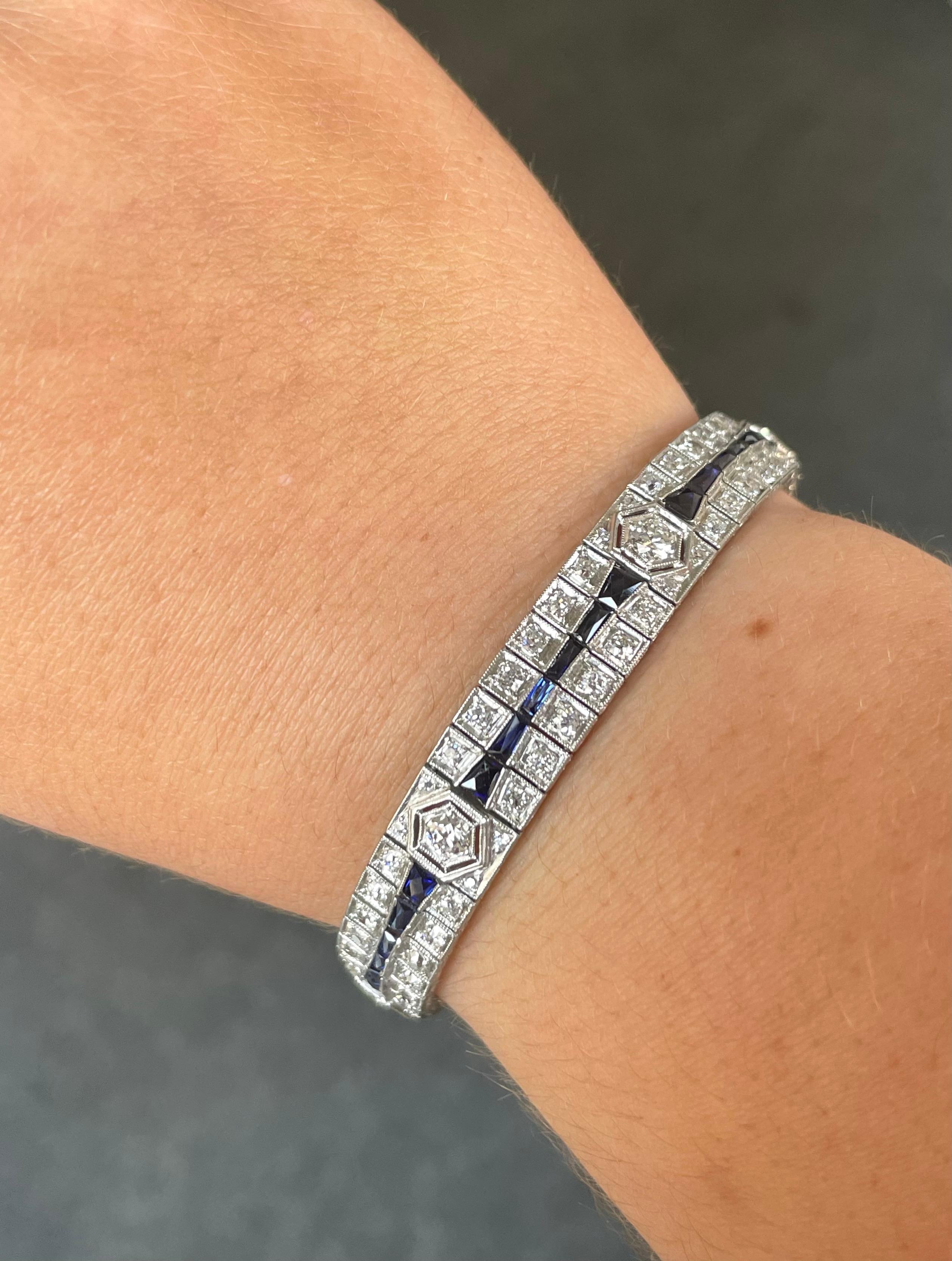 A truly one of a kind piece in exceptional condition, this beautiful Art Deco bracelet is an amazing example of the craftsmanship and detail of the period. 

The bracelet contains two rows of box-set 2mm round diamonds. Seven 3mm round diamonds set