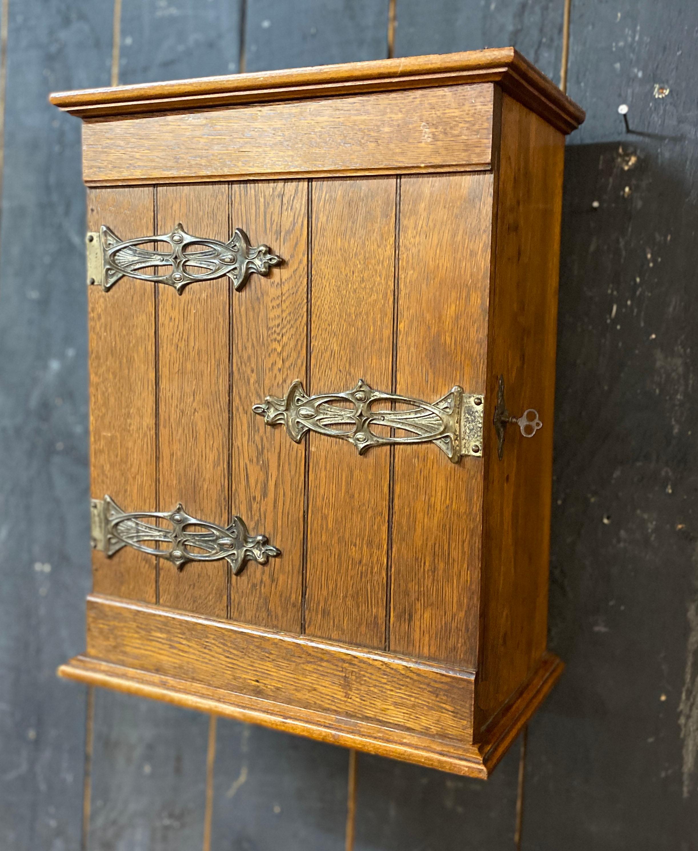 European charming arts and crafts wall cabinet circa 1900 with its original key For Sale
