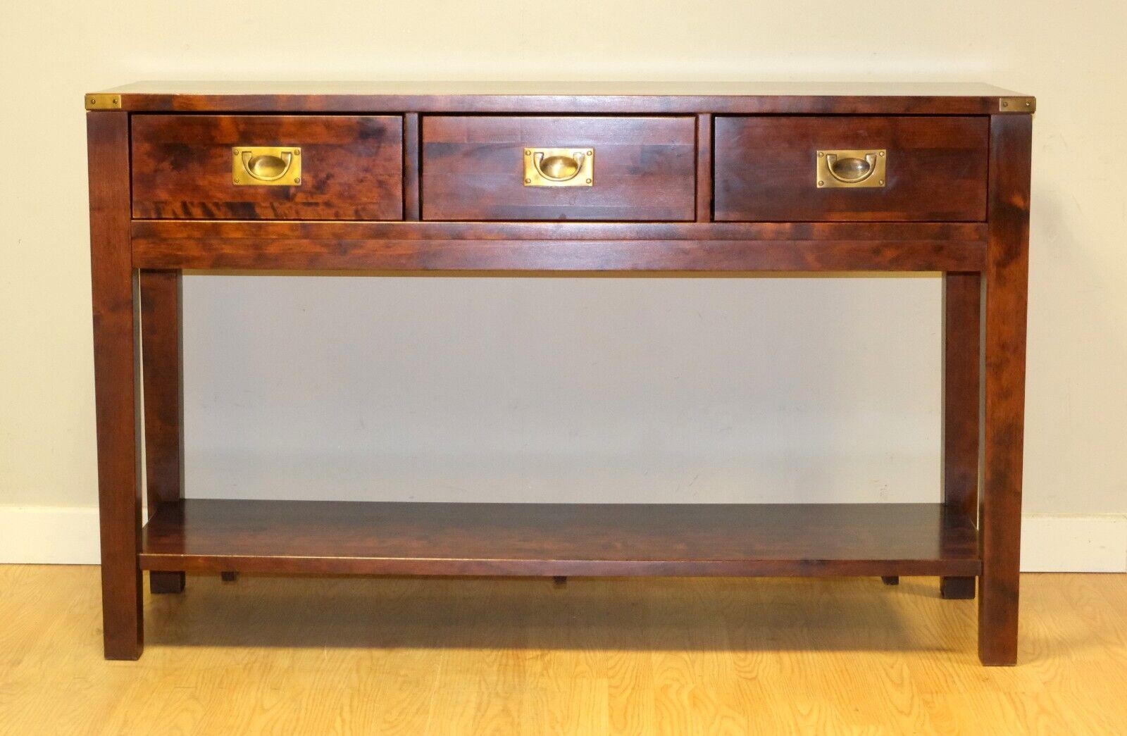 We are delighted to offer for sale this charming Laura Ashley Chaldon range birch campaign style sideboard/console table.

This piece draws inspiration from traditional period furniture with its campaign style and solid construction. It