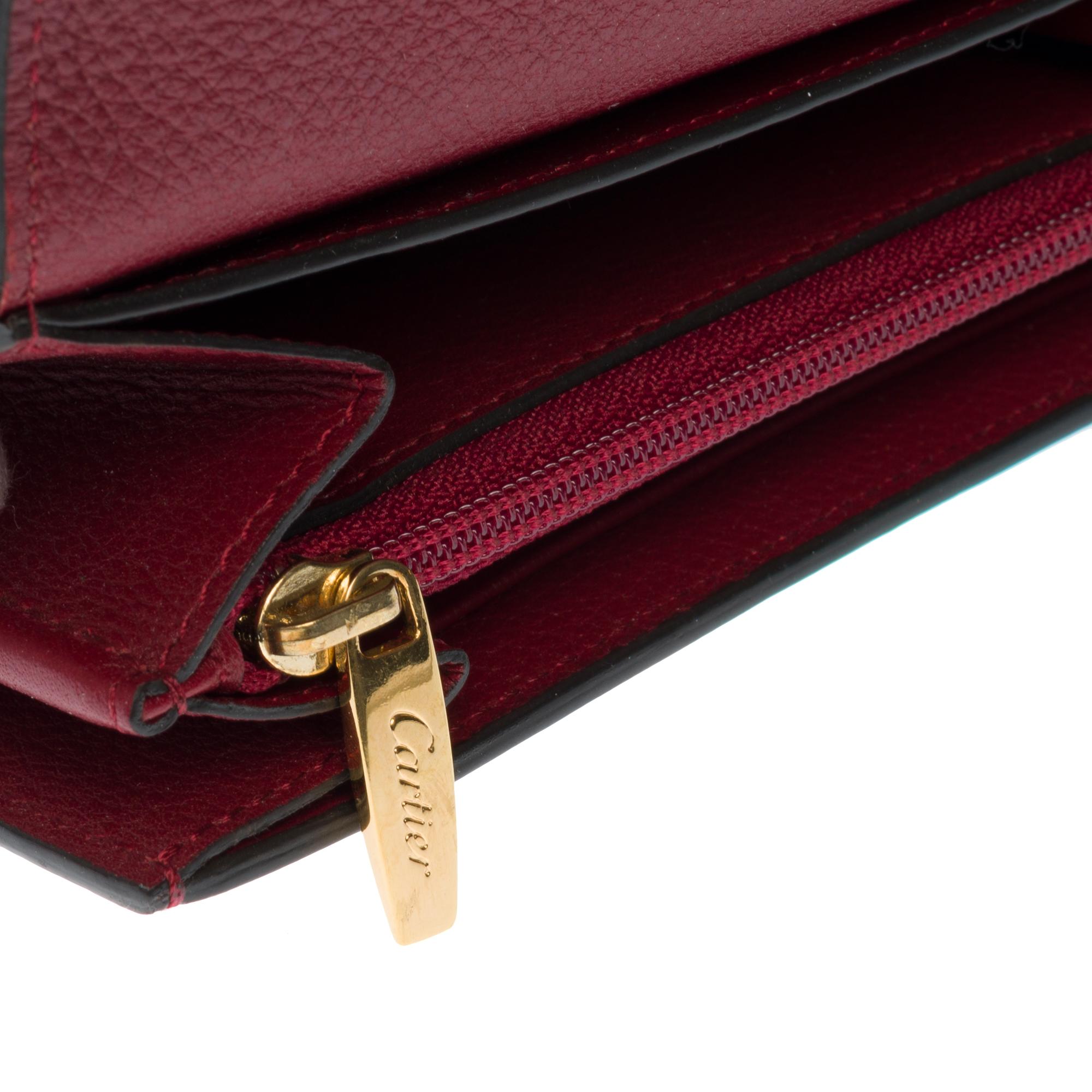 Charmante Cartier-Brieftasche aus bordeauxfarbenem Leder mit Goldbeschlägen Damen