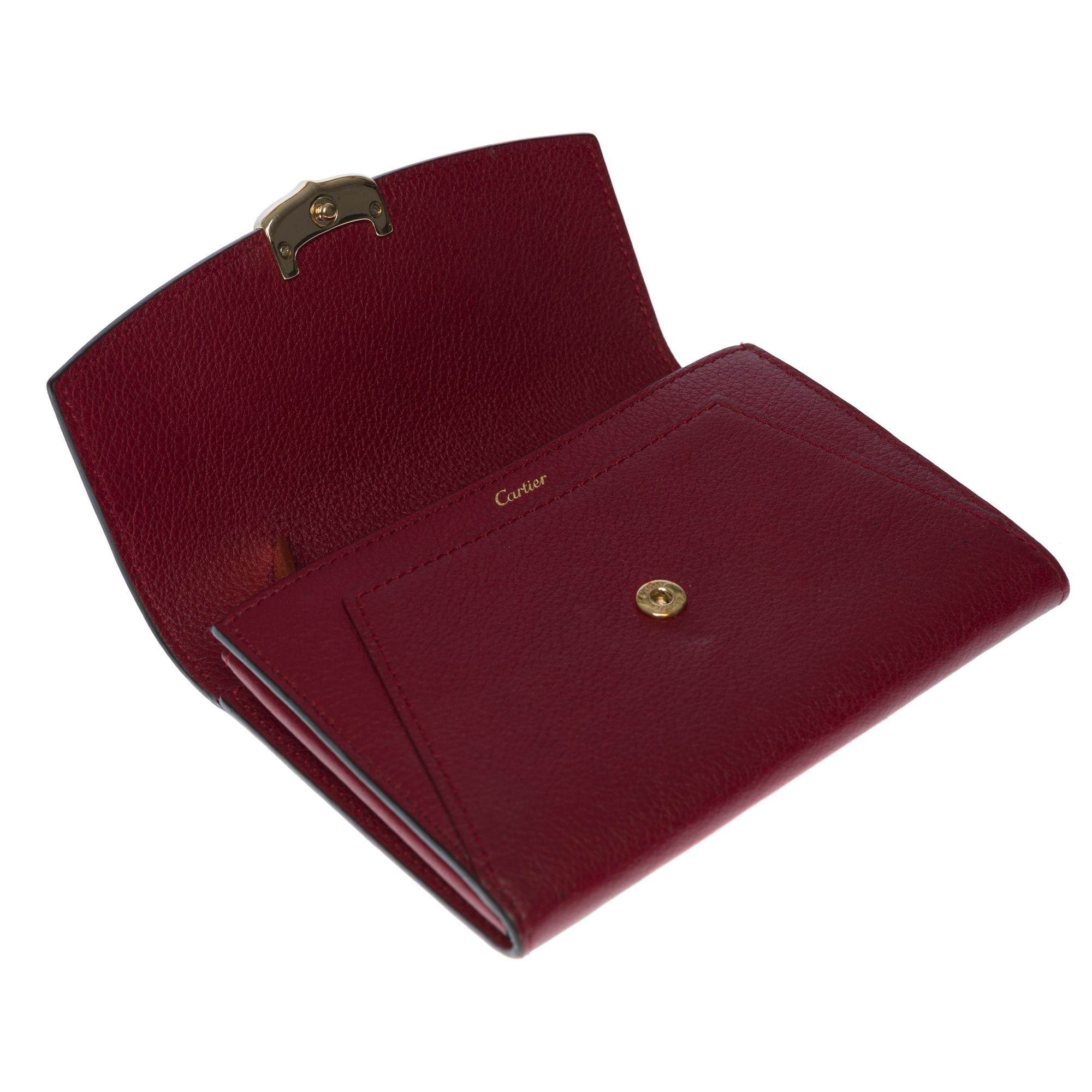 Charmante Cartier-Brieftasche aus bordeauxfarbenem Leder mit Goldbeschlägen 1