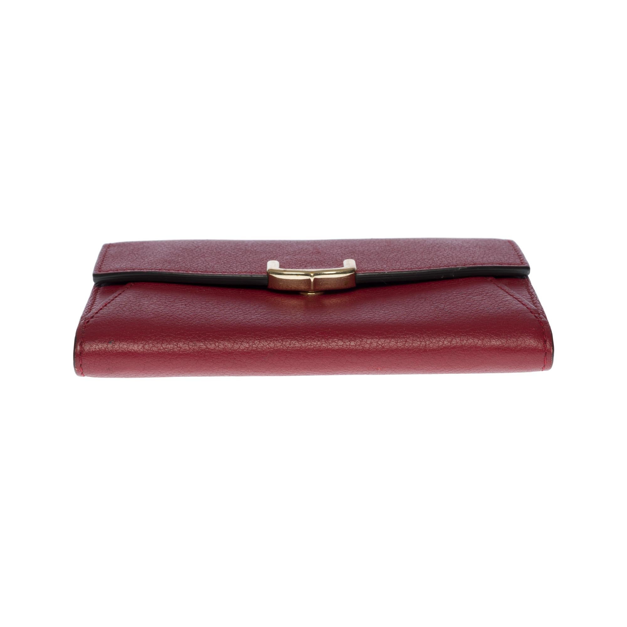 Charmante Cartier-Brieftasche aus bordeauxfarbenem Leder mit Goldbeschlägen 4