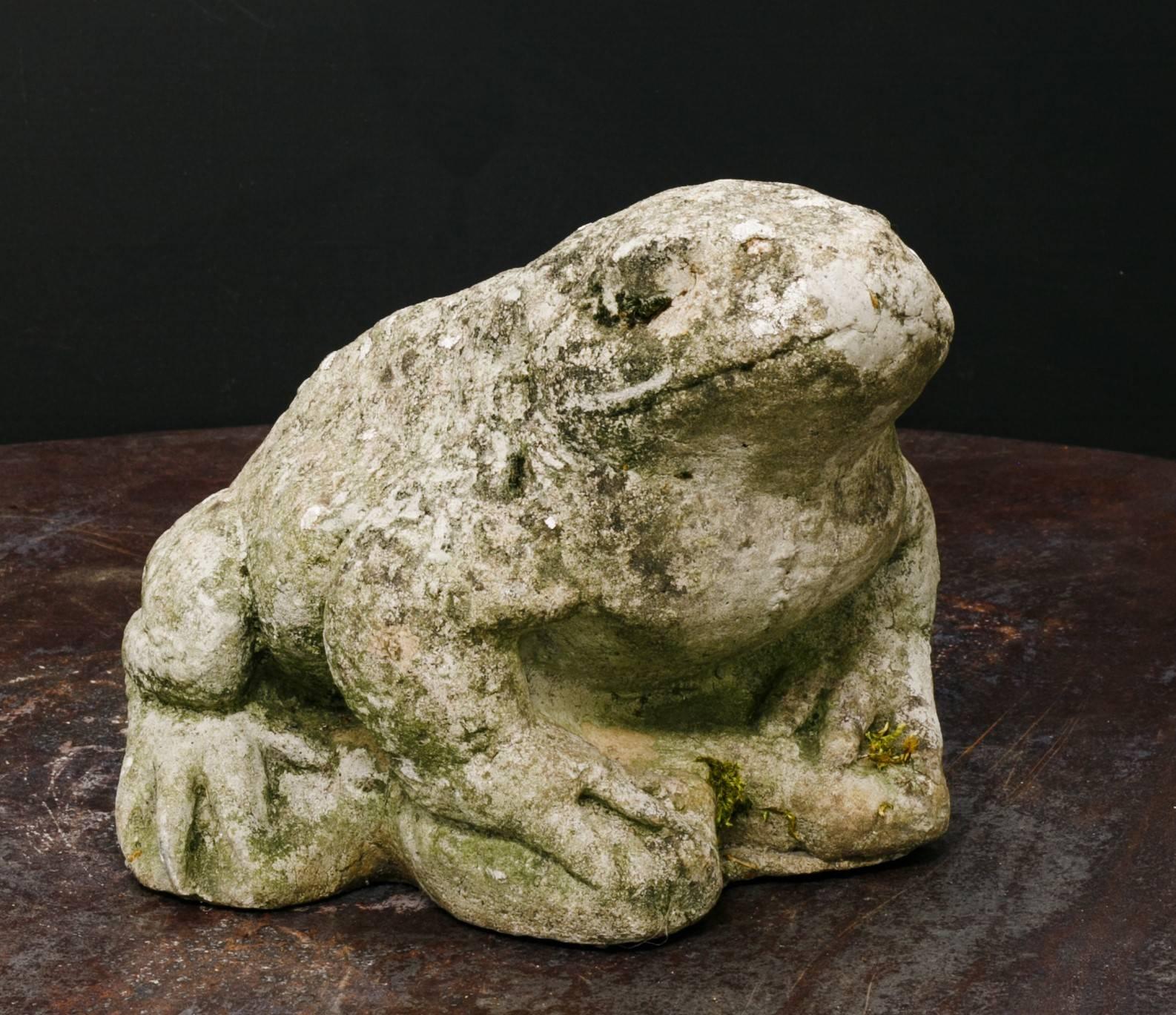 This little fellow is so chubby and cute. He has a wonderful patina from sitting outside for decades.
He will make a wonderful additional garden ornament to any home.

I am rather sure he is a toad, but he is kind of stylized and has funny feet