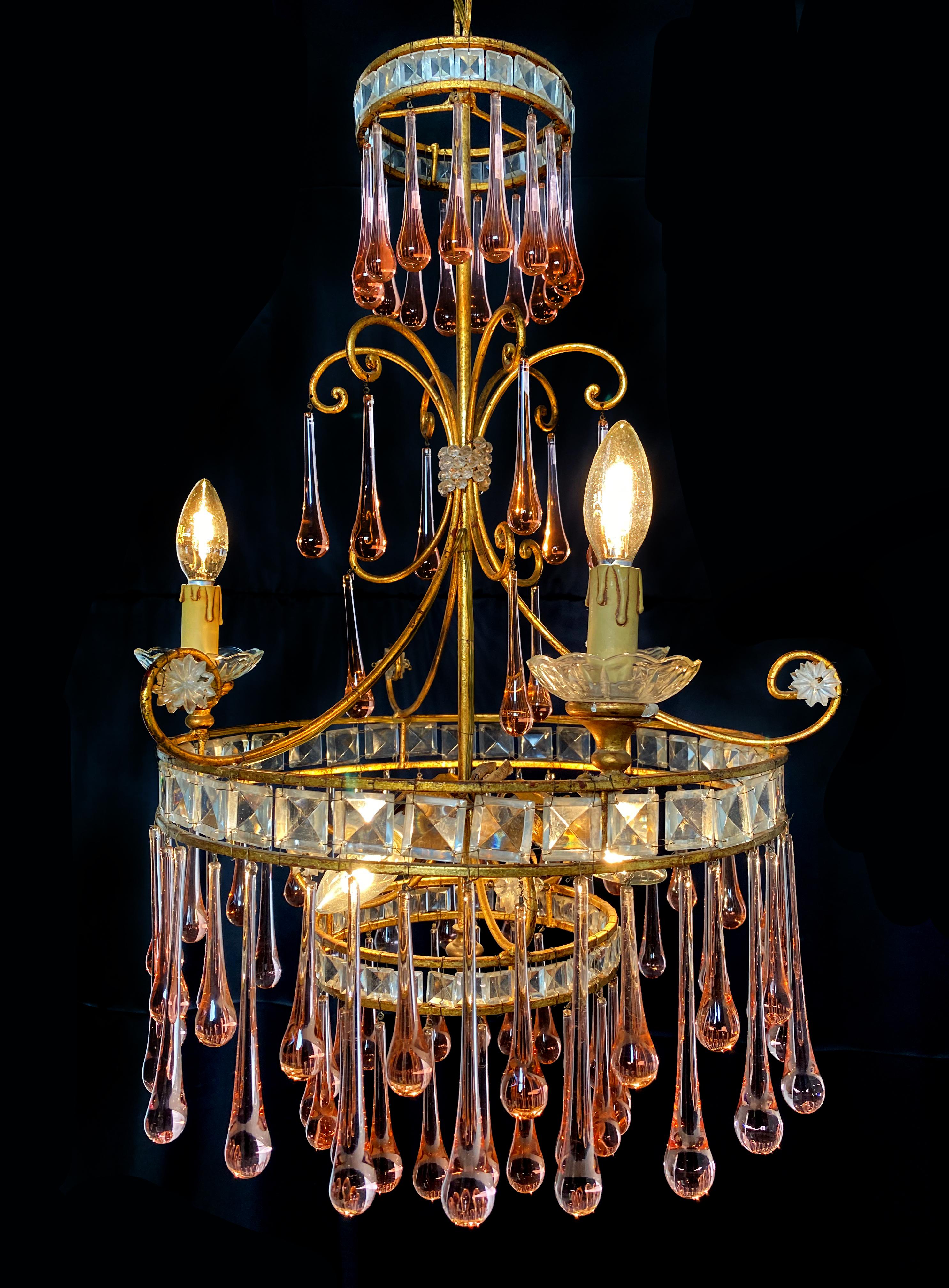 Elegant Venetian chandelier. Dozens of ambra drops hang from the golden canopy. Six small lights.
 