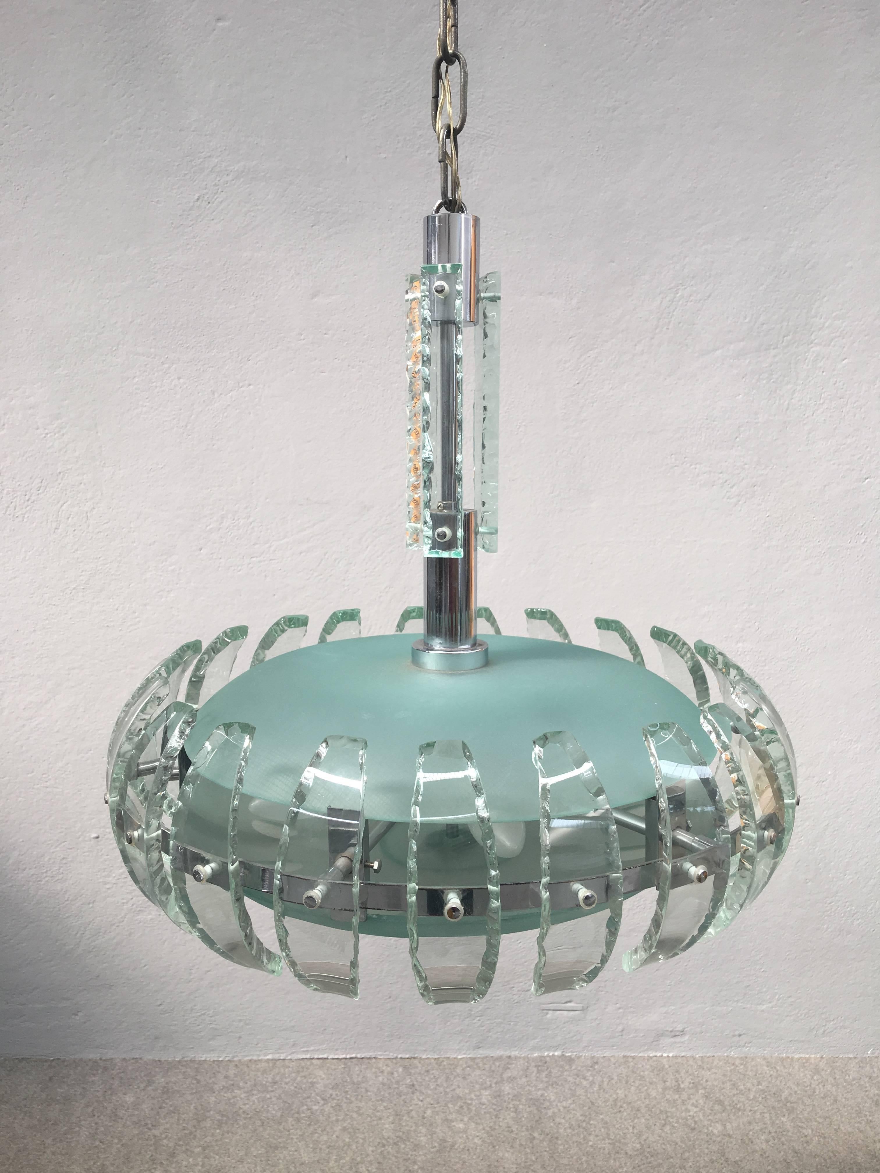 Wonderful chandelier attributed to Fontana Arte. Chrome and glass with pretty frosted glass petals surrounded the glass sphere.