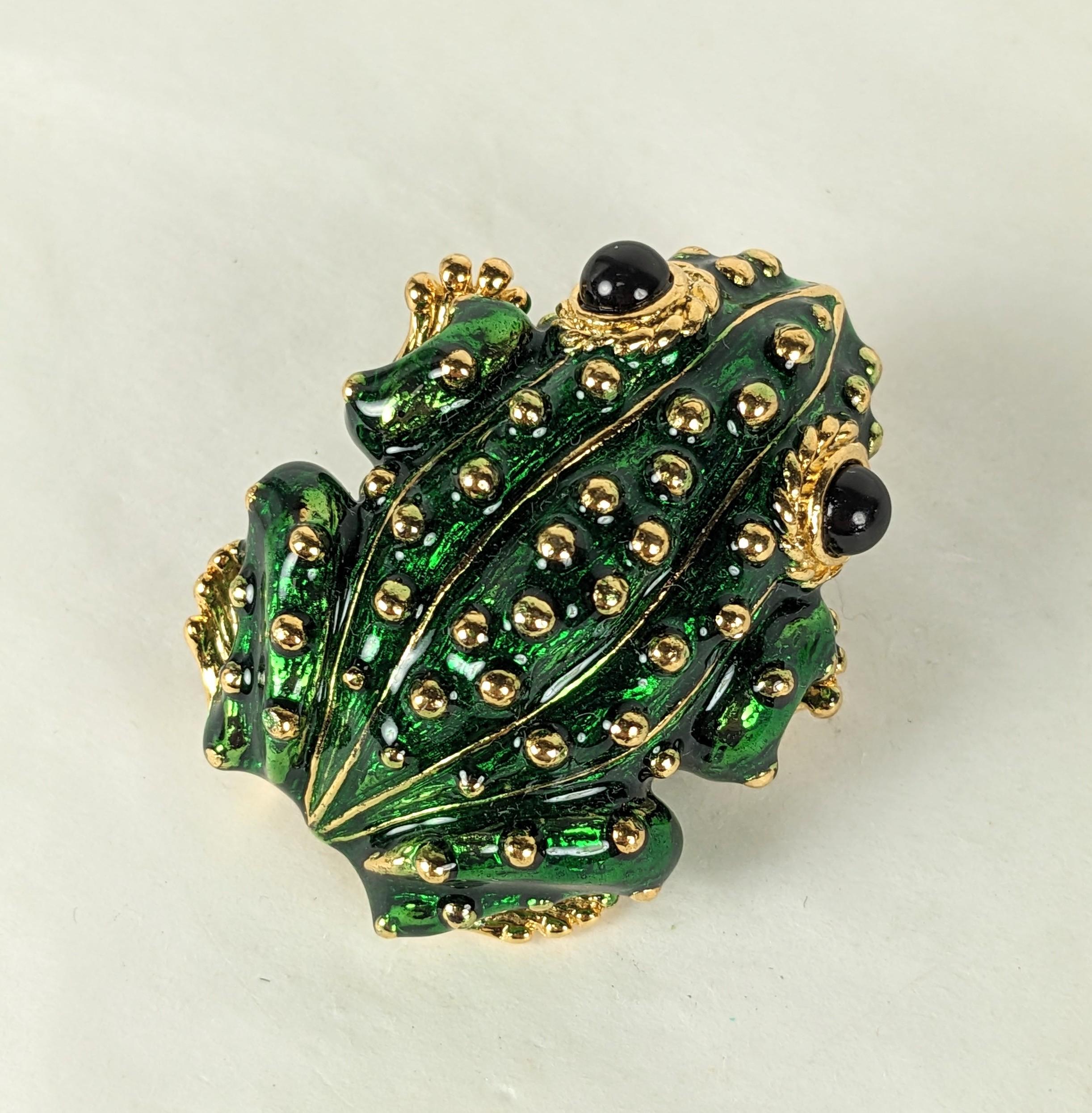 Charming Ciner Enamel Frog in the David Webb style from the 1980's. Deep green enamel studded with gold and jet beaded eyes. 
1980's USA.  2