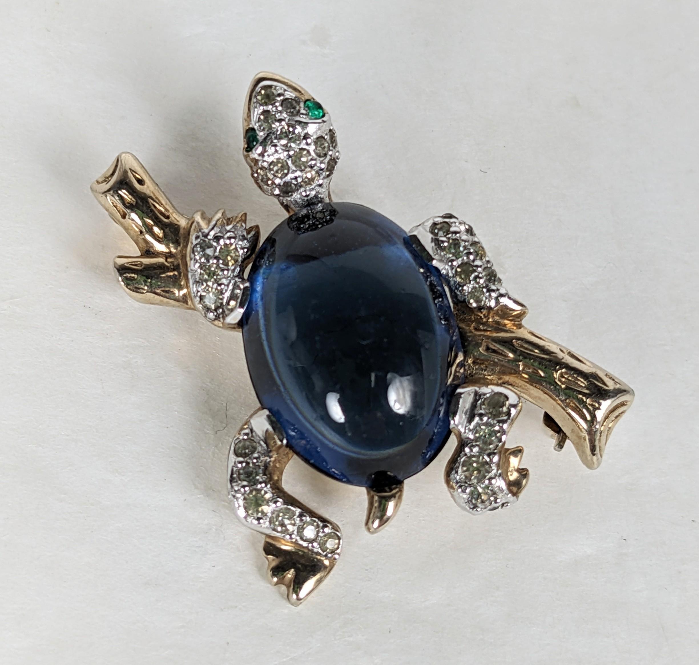 Charming Climbing Turtle Brooch from the 1960's, likely made by Jomaz. High quality faux with large sapphire cab belly with pave accents on a gilt branch. Unmarked. 1960's USA. 1.5