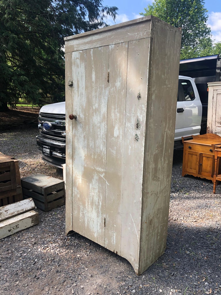 Hand made painted and distressed country closet cabinet having plank door that opens to reveal hooks inside. Great for an extra storage closet with charm.
Interior 73 H 16.25 D
80