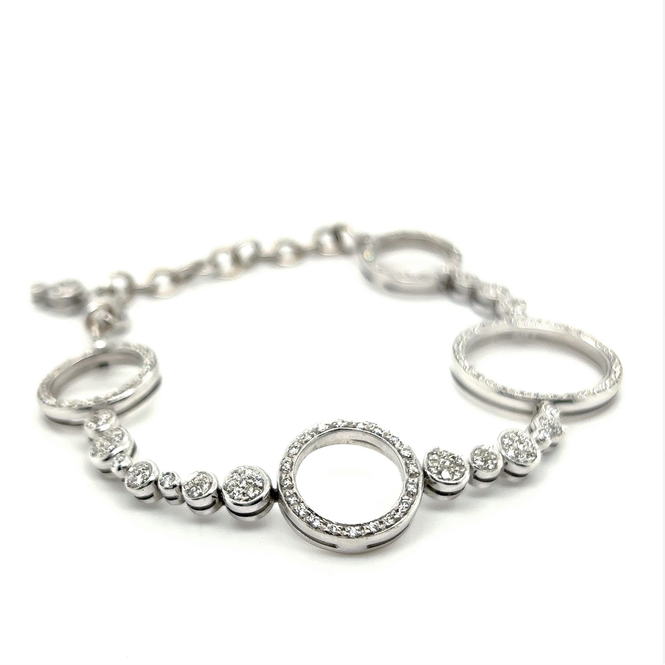 This amusing bracelet is both classic and extraordinaire. Reminiscent of the bubbles of champagne, its charming design brightly sparkles with a fine scattering of diamonds. 

The bracelet is made of 18K white gold and set with brilliant-cut diamonds