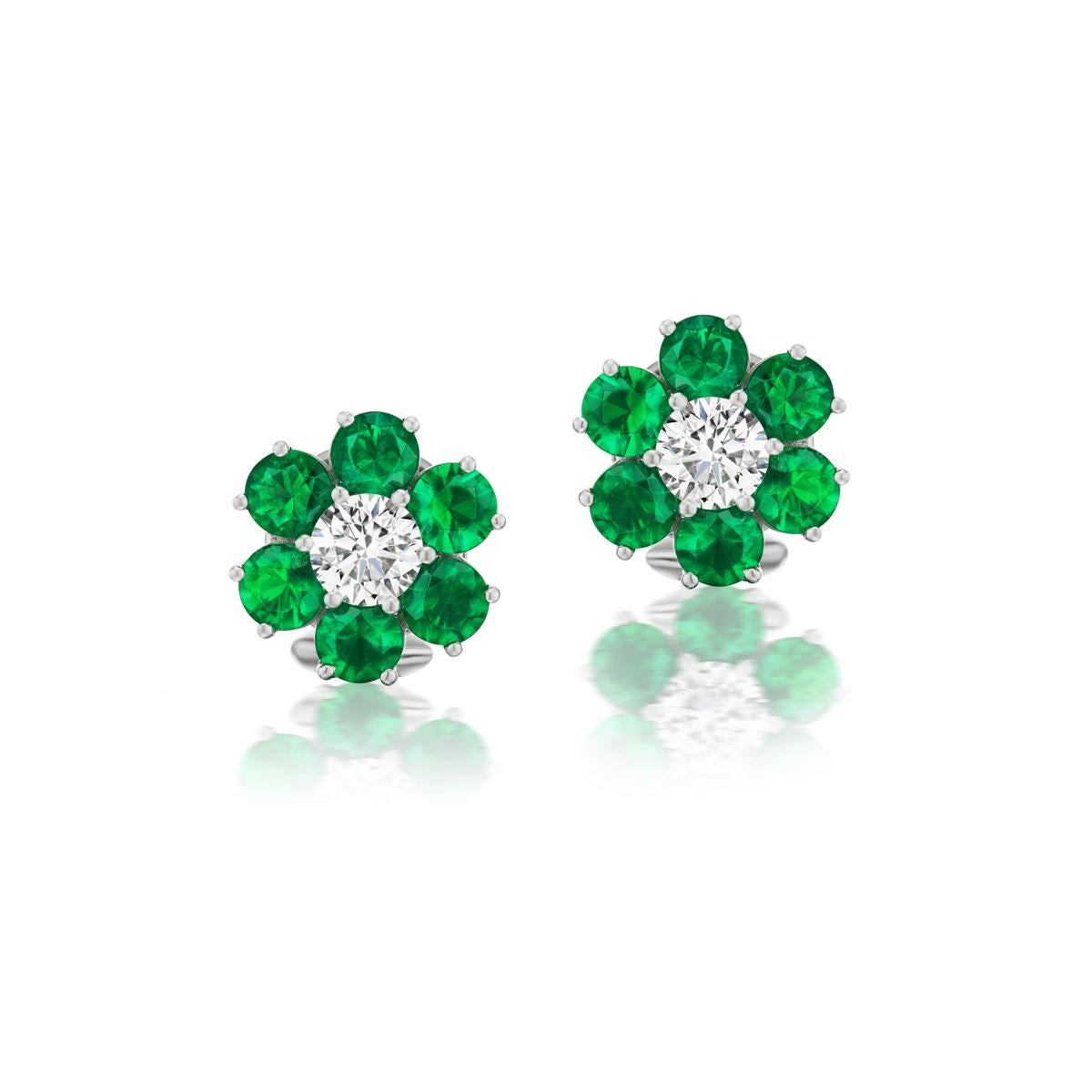CHARMING EMERALD AND DIAMOND EARRING
Radiant green hued emeralds surround these precious diamonds to form a pleasant floral pattern in these emerald earrings

 Item:	# 04105
Metal:	Platinum
Lab:	         Gia
Color Weight:	2.45 ct.
Diamond